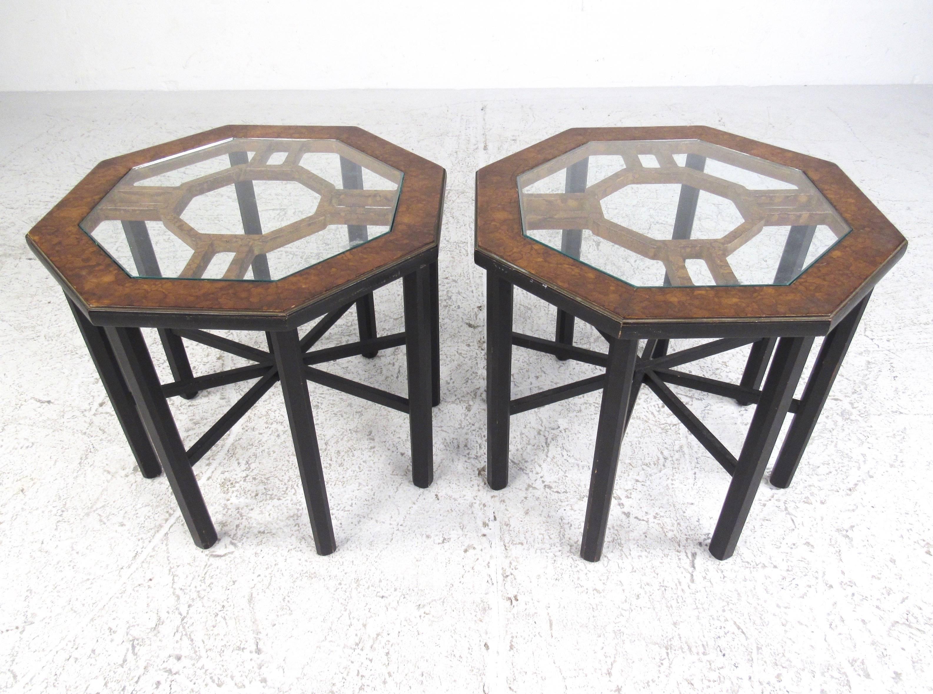 This elegant pair of Mastercraft style Mid-Century end tables features intricate eight legged octagonal design. Burl wood tops with inset glass look great in any seating setting, for home or business. Ebonized base features unique star-like