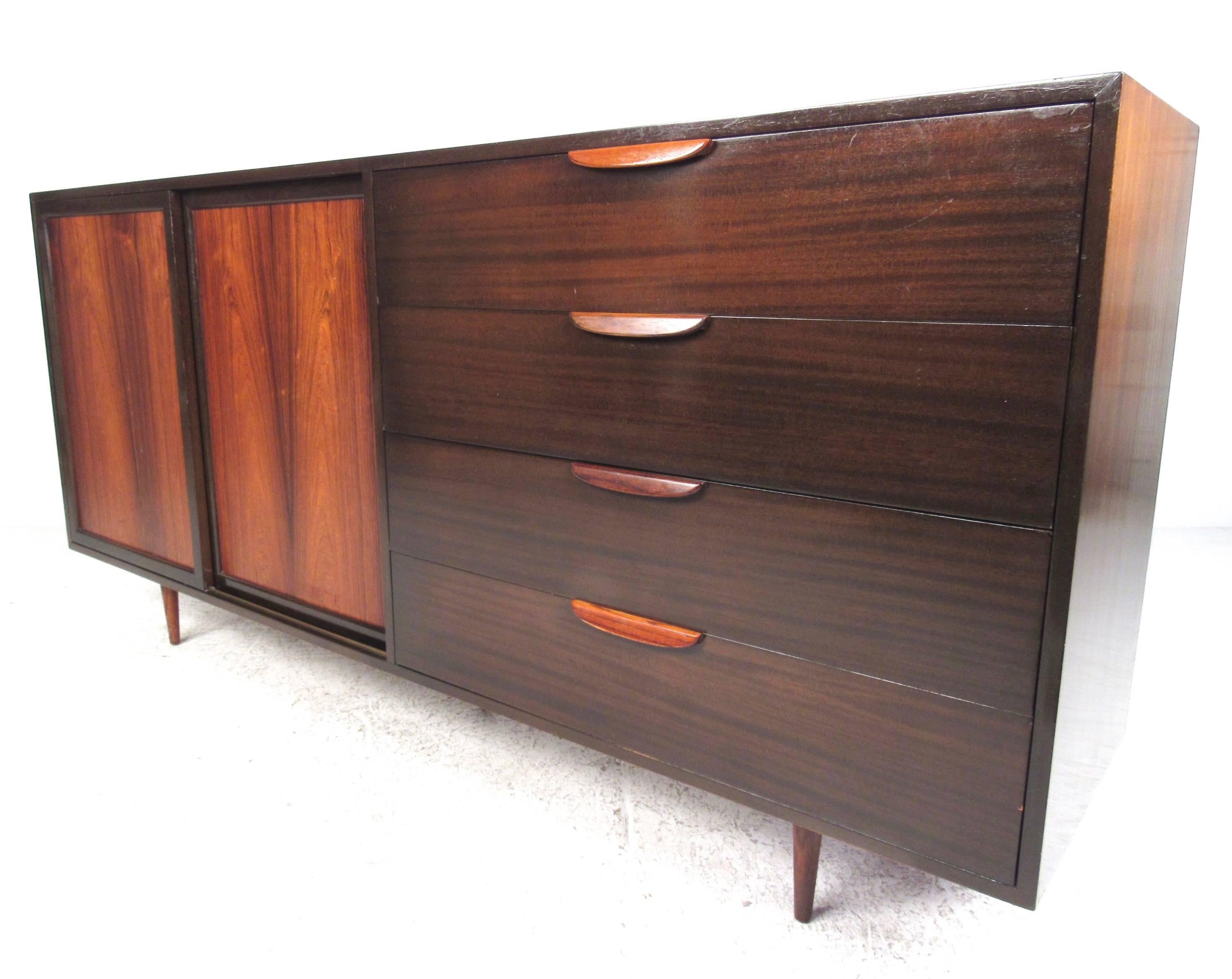 This unique side by side storage piece by Harvey Probber features spacious drawers for storage in any room. Perfect Mid-Century Modern piece for use as a credenza or bedroom dresser. Beautiful vintage mahogany and rosewood construction is