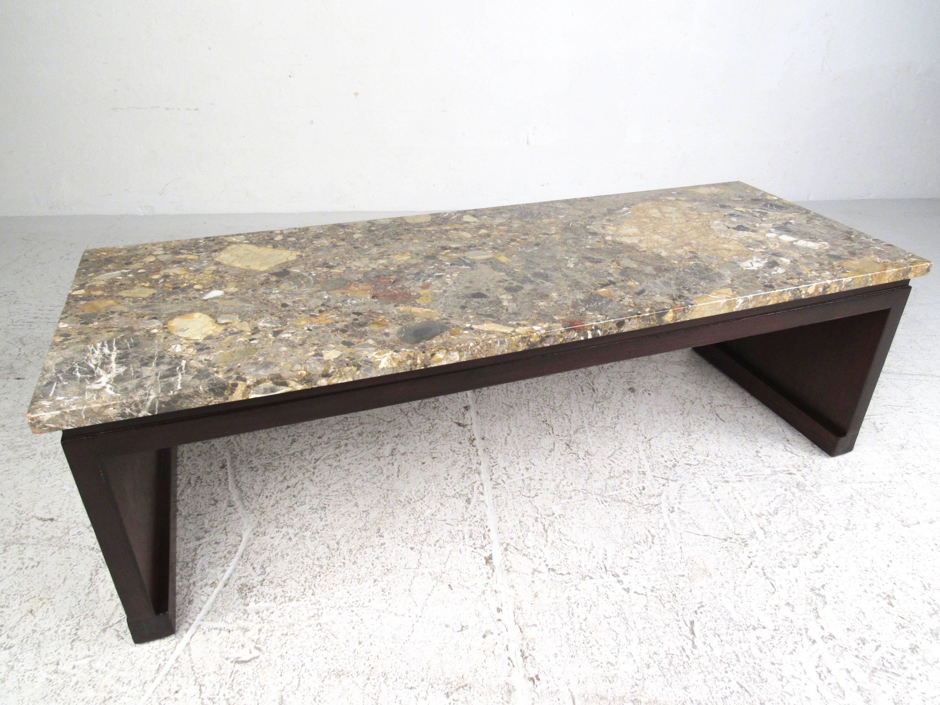 This unique vintage coffee table features a beautiful vintage marble-top set on lacquered hardwood sled base. Perfect table height for use as a coffee or cocktail table at home or business, original manufacturer's label attached. Sturdy table can