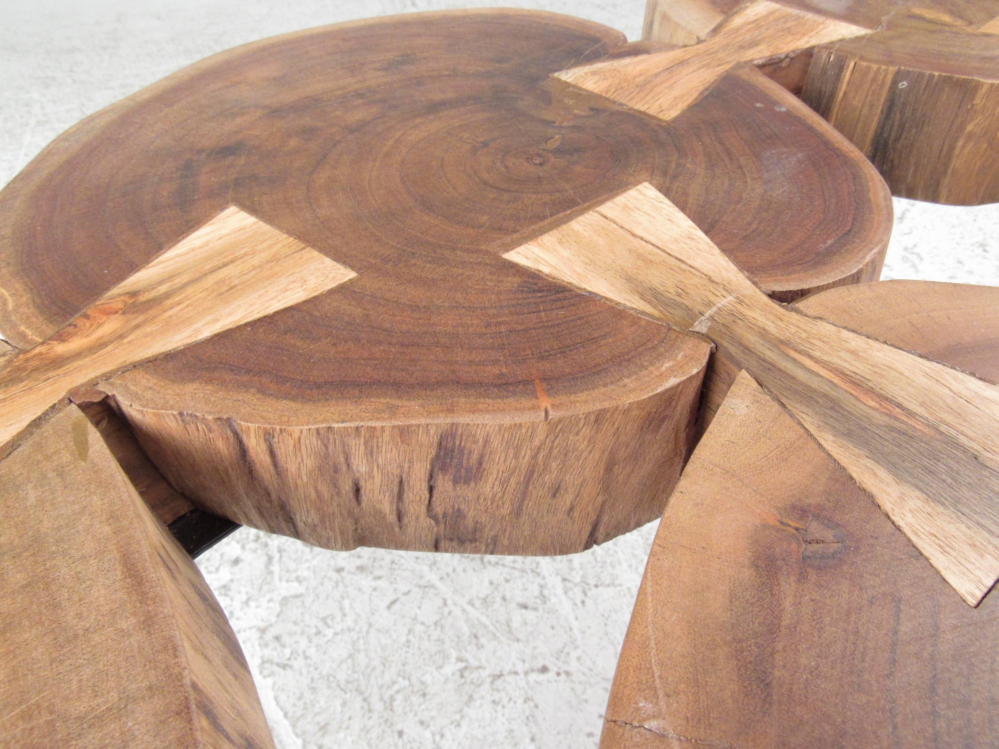 Coffee table with six tree stump circles joined by bow tie joints. Intron hair pin legs give a modern flair to the rustic top. A functional design that is sure to make a lasting impression in any home, business, or office.

(Please confirm item