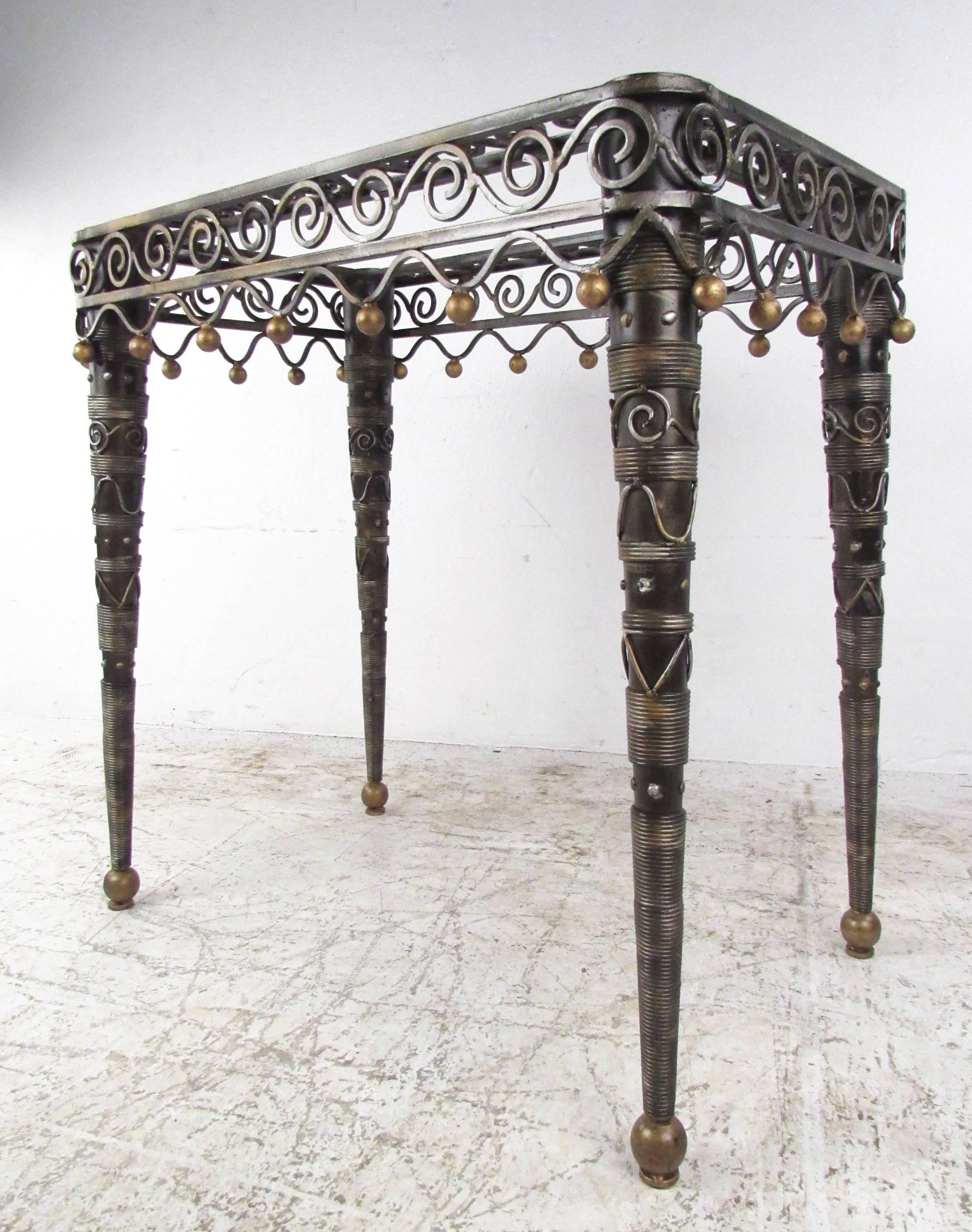 This sculpted metal side table features unique decorative design points with tapered legs, painted brass accents, and woven wire details. Perfect height for sofa side table, lamp table, or for use as an impressive accent table. Please confirm item