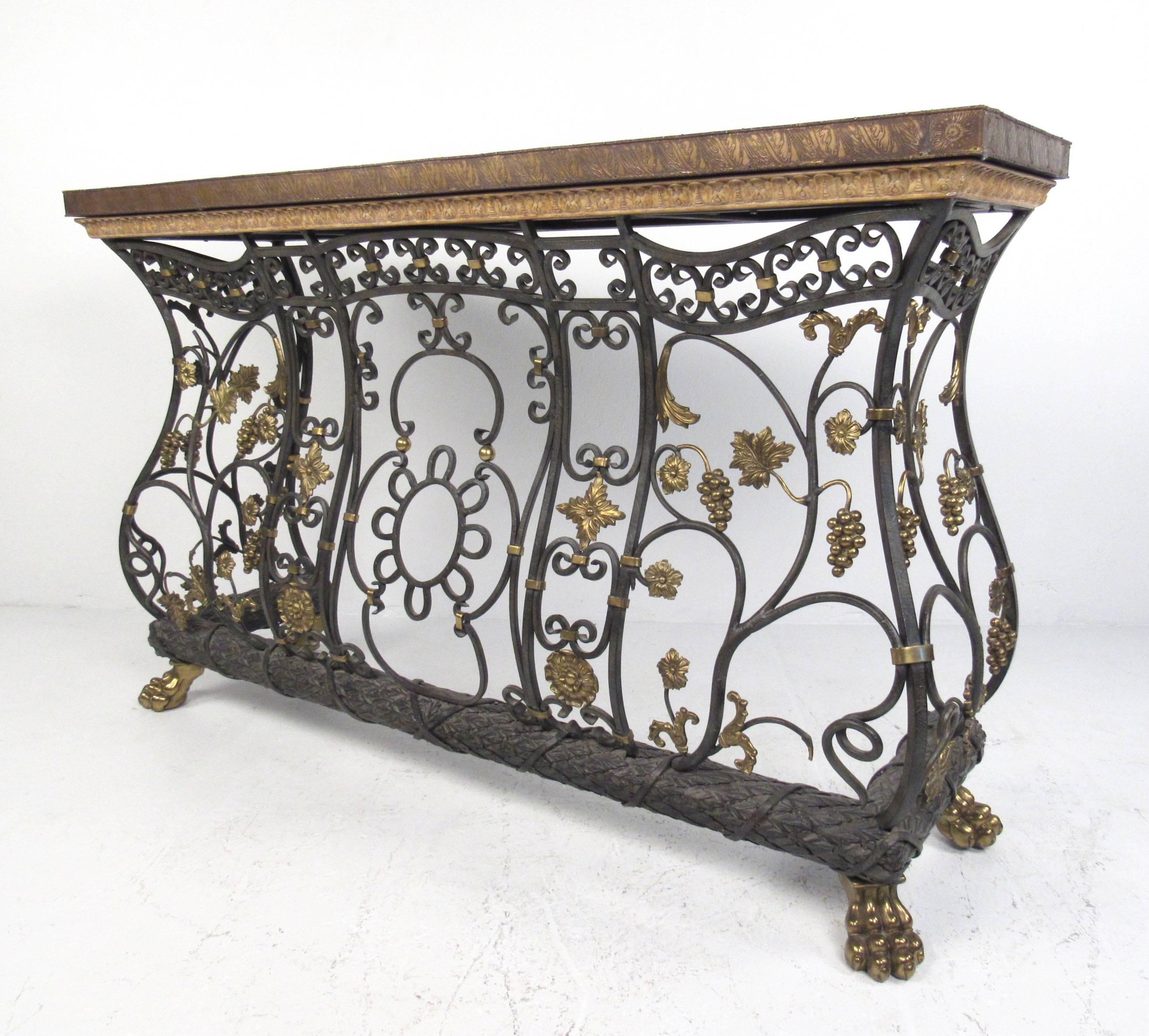 This elegant iron and bronze console table is designed for versatile use with a stylish mixed-metal composition and mosaic-tiled top. Heavy, high quality construction with masterful attention to detail, it exudes that old-world charm and stately
