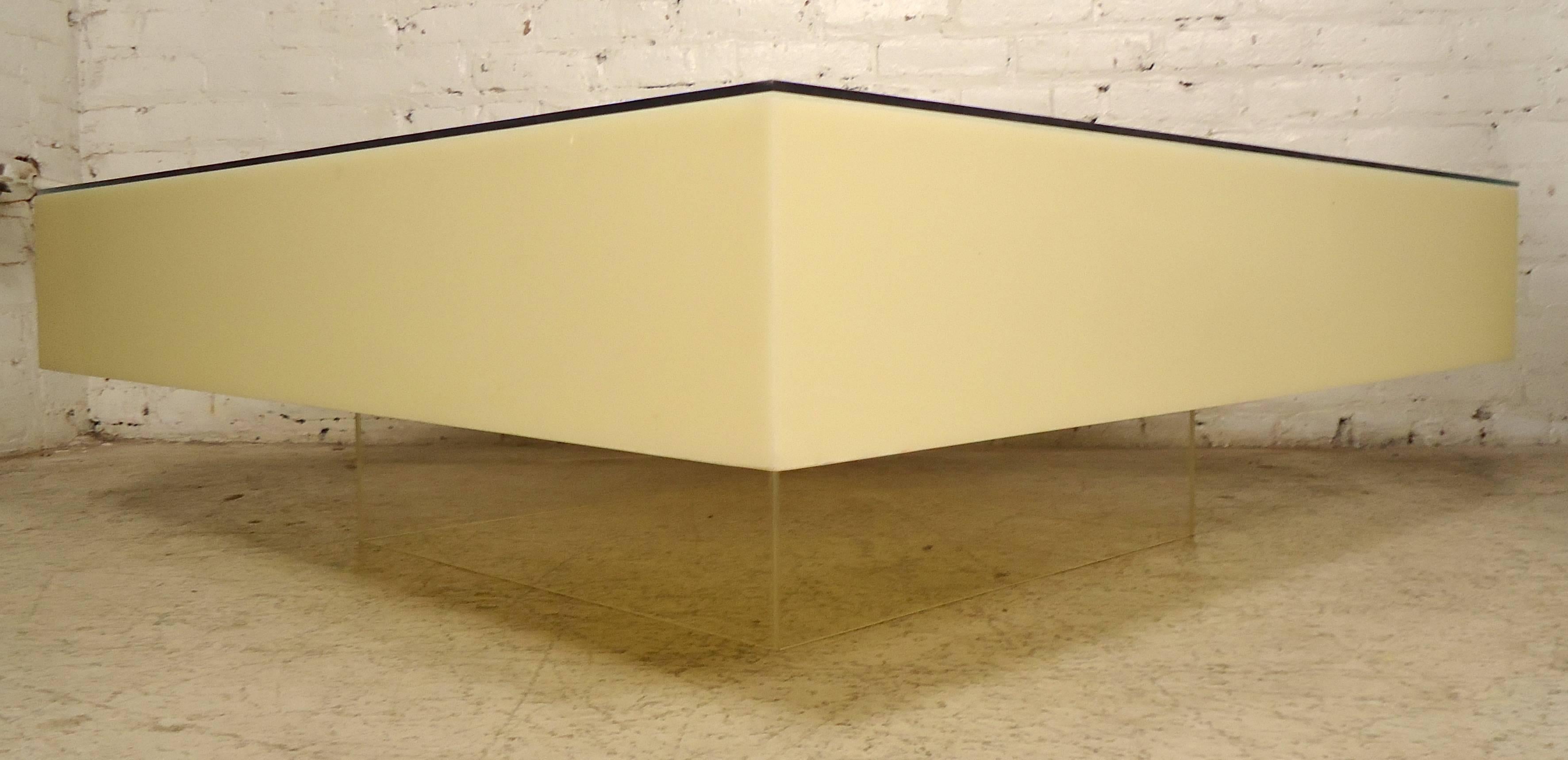 Impressive coffee table made of thick opaque Lucite and glass top. Clear Lucite base. Very unique style. Lights can be set underneath for an illuminated effect.

(Please confirm item location - NY or NJ - with dealer).
 
