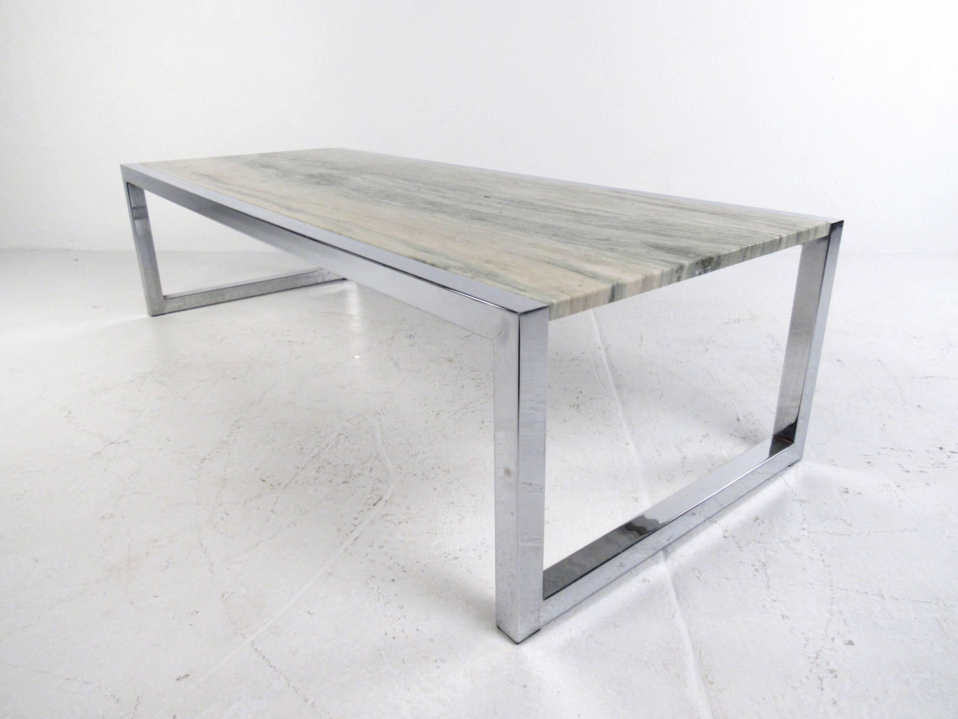 This vintage modern chrome and marble coffee table features a uniquely colored slab marble top in a floating chrome sled leg base. Heavy chrome frame provides a stabile base for the beautiful top. Please confirm item location (NY or NJ).