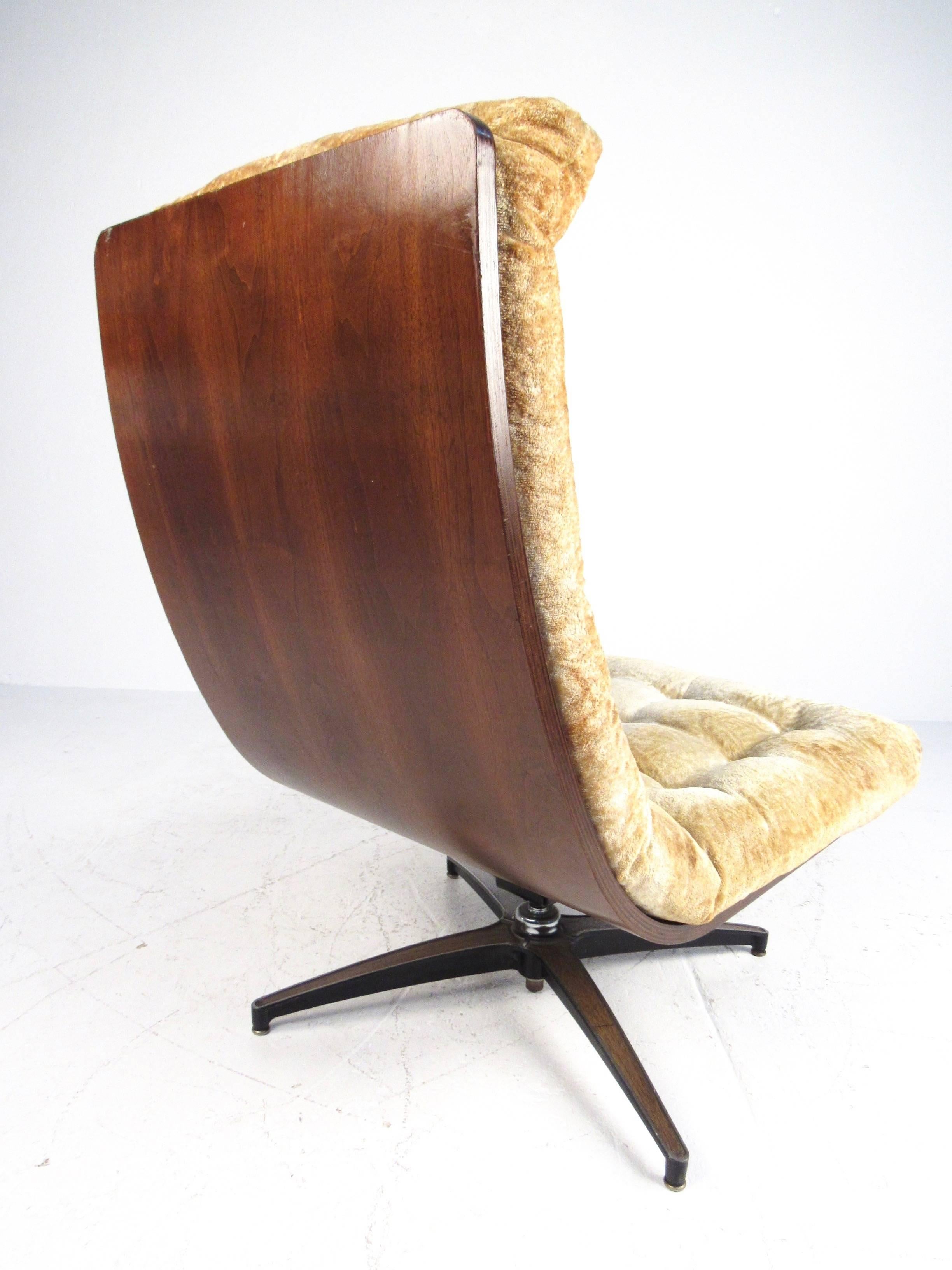 This vintage modern swivel chair features a stylish scoop chair style seat with tufted vintage fabric. Bentwood shell back wonderfully compliments the Mid-Century slipper design, while the spacious plush seat makes this a comfortable addition to any