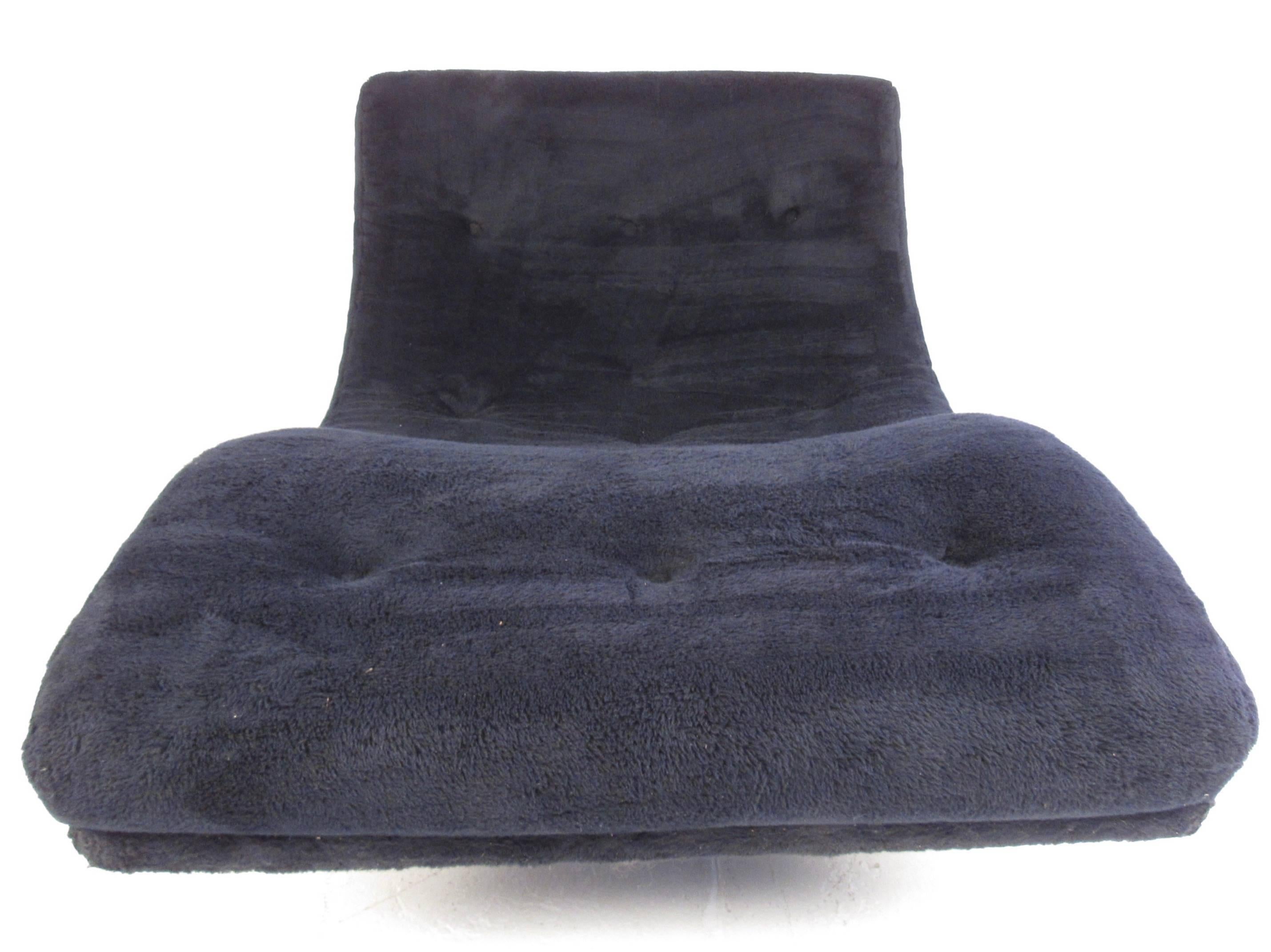 This stylish Adrian Pearsall rocking lounge chair features a spacious sculpted wave like seat with tufted black fabric and walnut rockers. Original manufacturer's label still attached underneath showing it's been made by Craft Associates. This