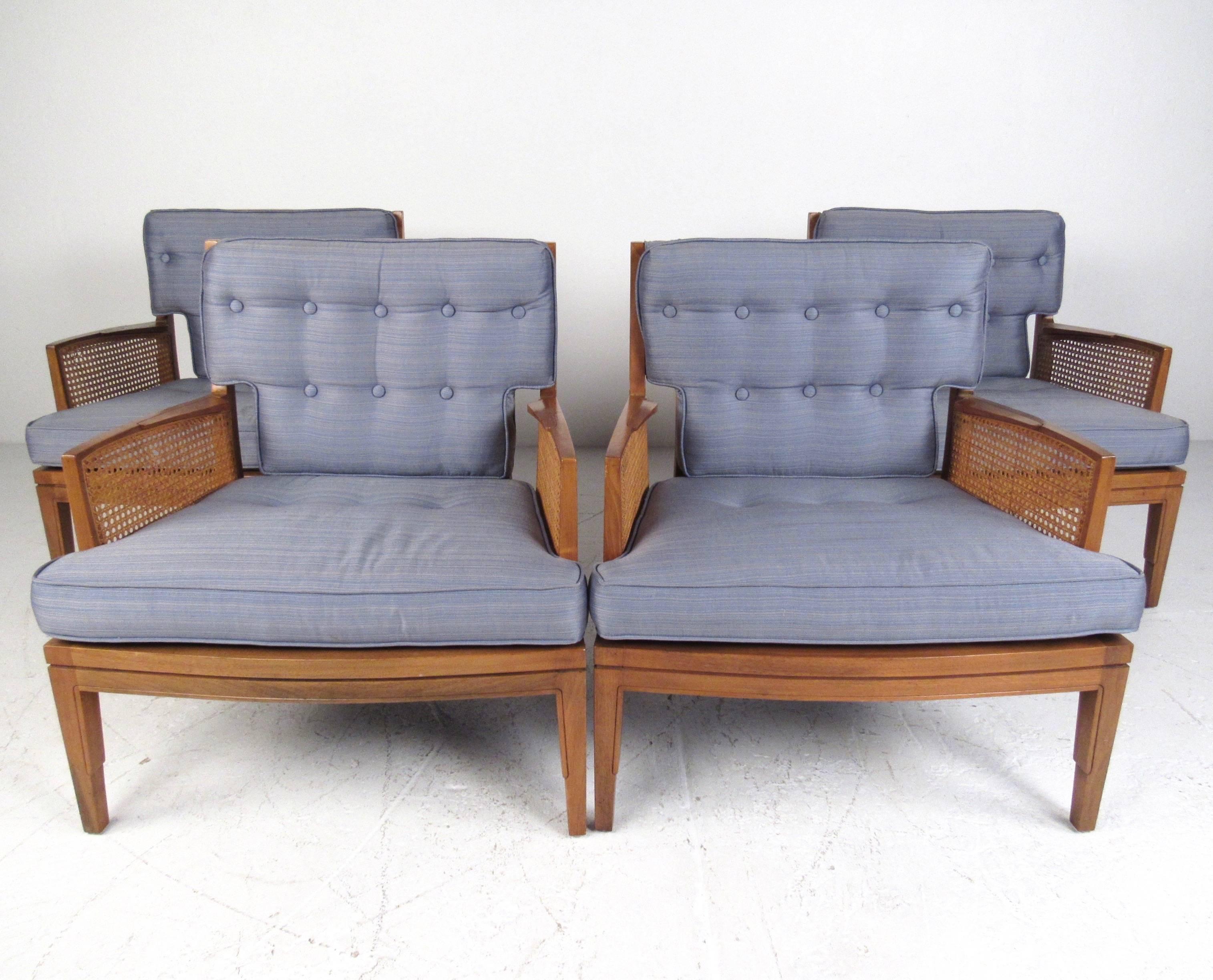 This beautiful set of four vintage chairs features tufted vintage upholstery, sculpted walnut frames, and unique caned armrests. Hard to find matching set of four armchairs make an excellent addition to any living room or waiting room. Wonderful mix