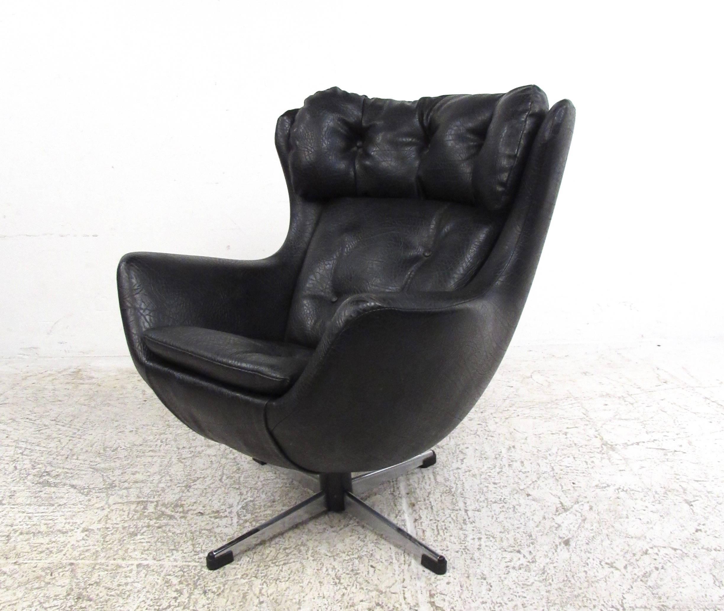 This hard to find scale model swivel lounge chair features tufted vinyl upholstery and the impressive design style of Mid-Century master Arne Jacobsen. This piece may have been originally used as a sales model, it's unique size makes a memorable
