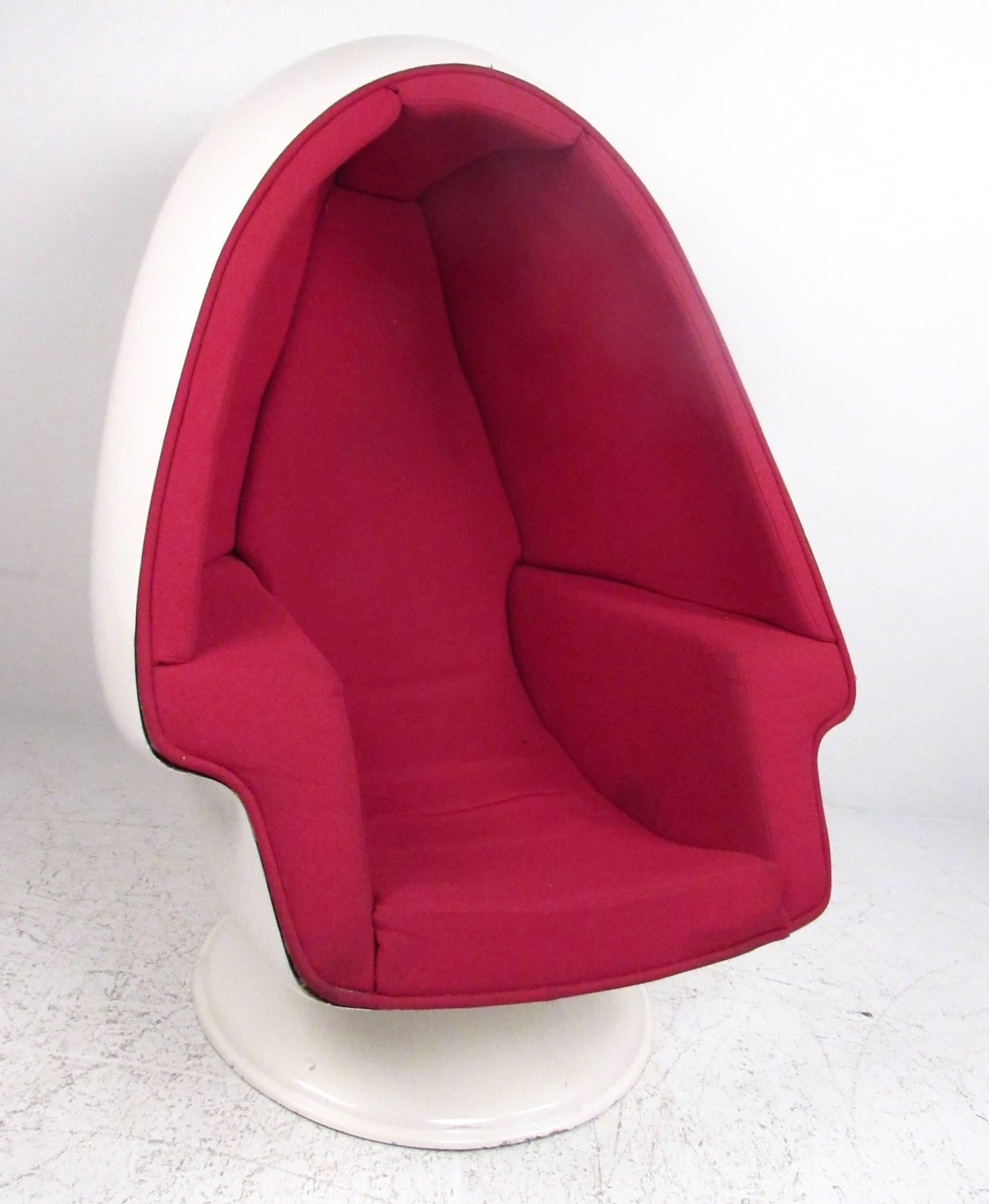 This vintage fiberglass Space Age style egg chair features comfortable molded upholstery creating a womb like interior ideal for listening to music. Original interior speakers allow the piece to be hooked up to home stereo system using connectors