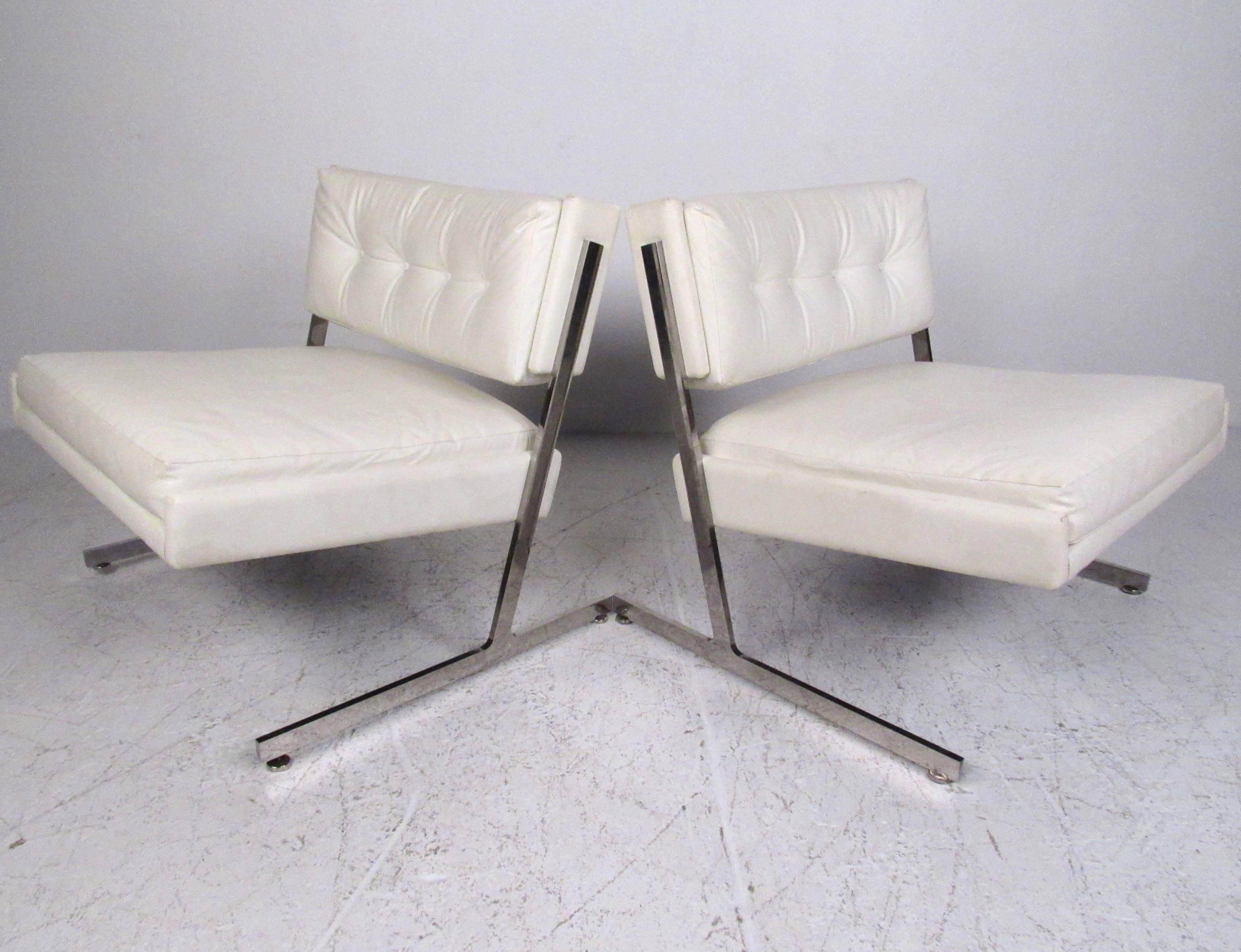 This stunning pair of modern lounge chairs by Harvey Probber feature tufted vinyl seat backs with wide slipper seats. Cantilevered heavy chrome frame makes for an impressive mid-century addition to any seating arrangement. Please confirm item