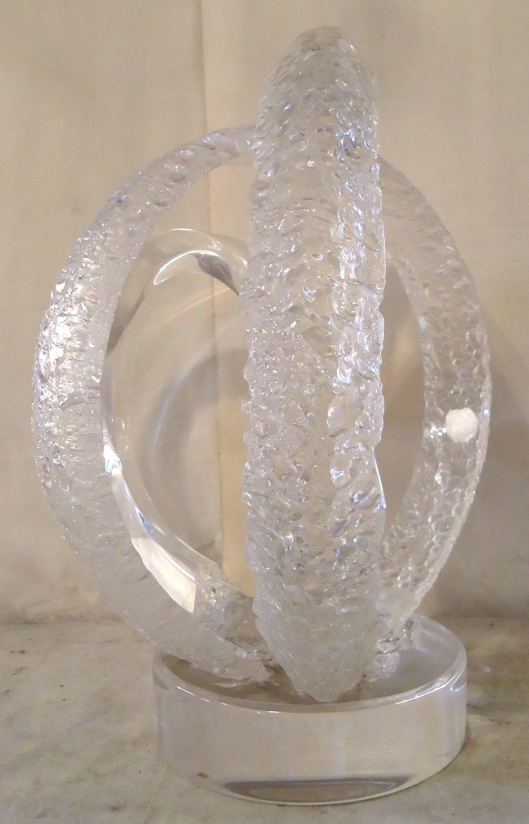 Free form art made of thick clear lucite with intersecting rings. Two rings have etched texturing and one is clear.

(Please confirm item location - NY or NJ - with dealer)

