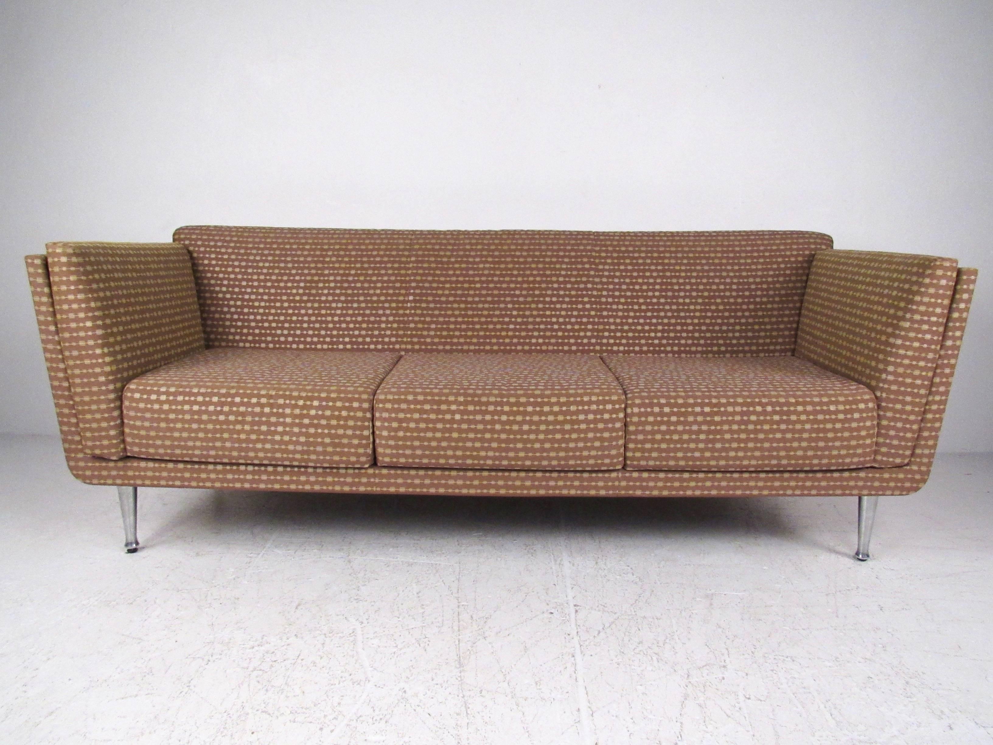 This stunning oak wrapped sofa features stylish upholstery, tapered aluminium legs, and oak wrapped frame. Designed by Mark Goetz for Herman Miller, this unique piece makes a stunning seating addition to any interior, whether it's home or business.
