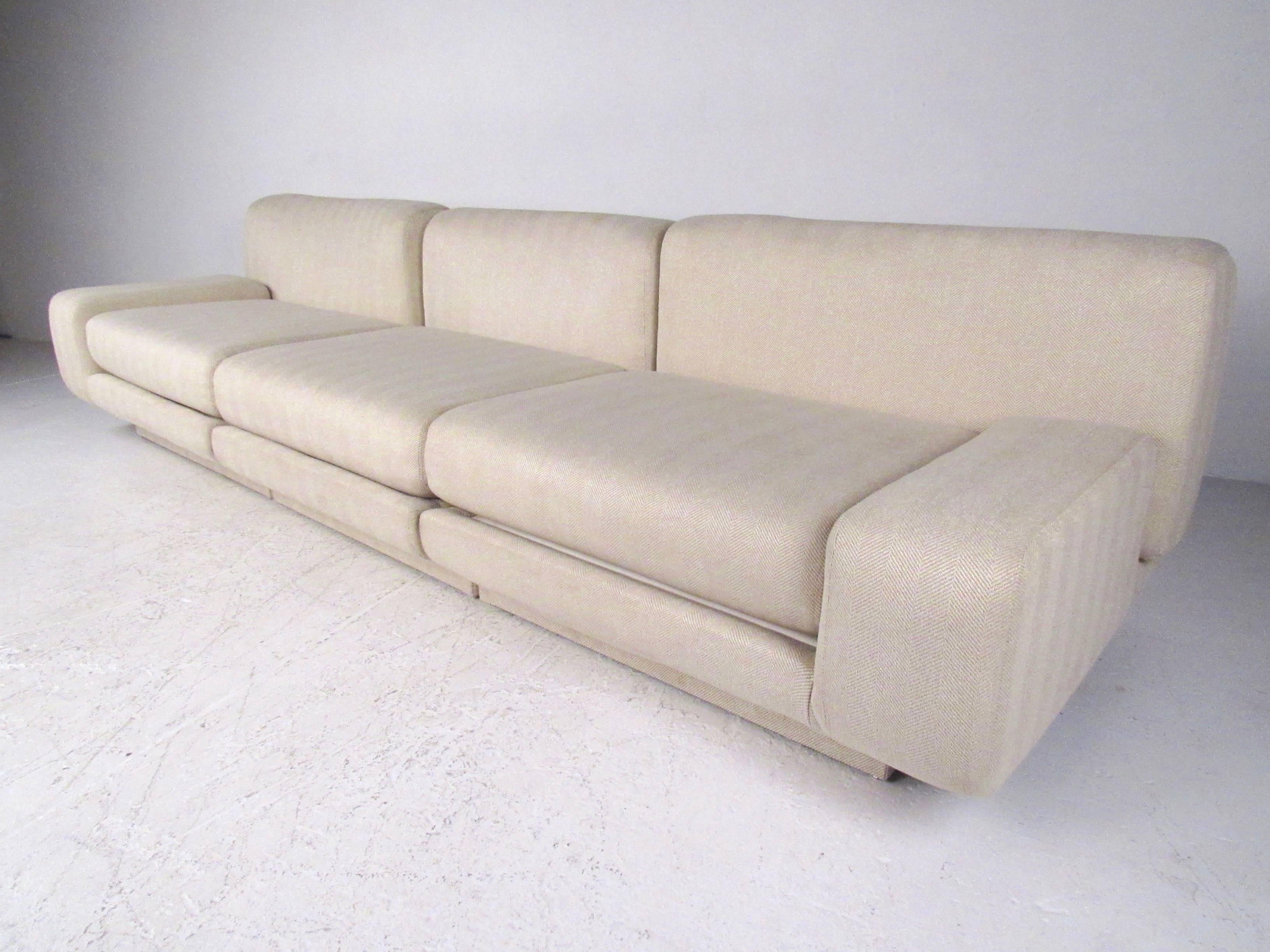 This three-piece contemporary sofa features a stylish sectional design with wonderful modern details. The simple yet comfortable design of this Milo Baughman style three-piece sofa makes a stunning addition to any interior. The two outside chairs