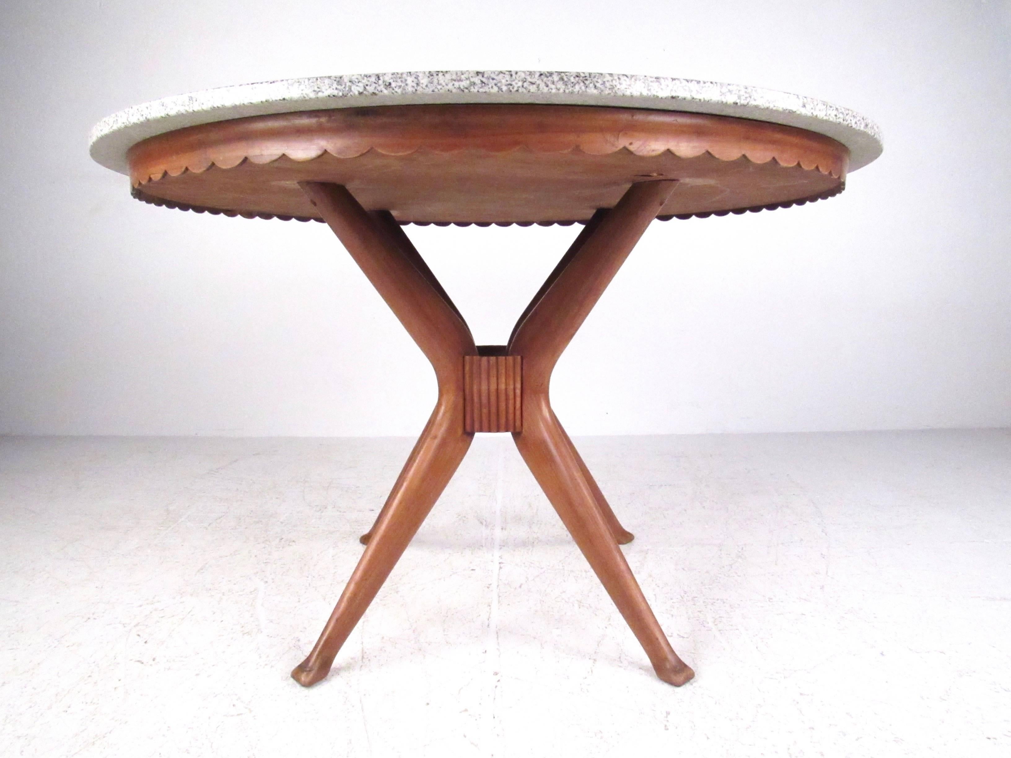 This vintage modern round dining table features an exquisite Dassi style sculpted base, and thick marble top. The unique design details compliment the pedestal style base and add to the charm of this mid-century Italian table. Please confirm item