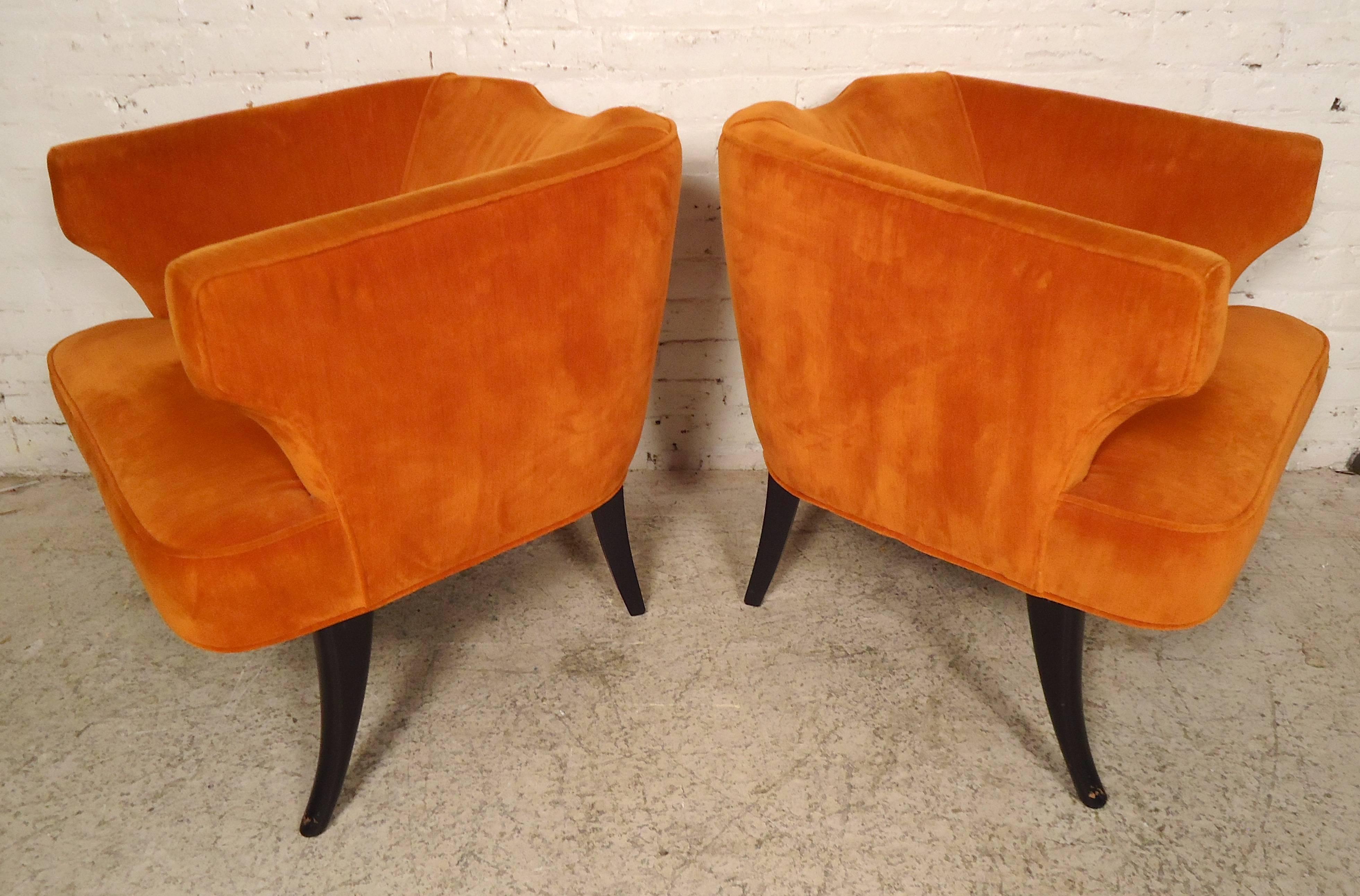 Pair of vintage modern upholstered chairs with unusual rounded back and 