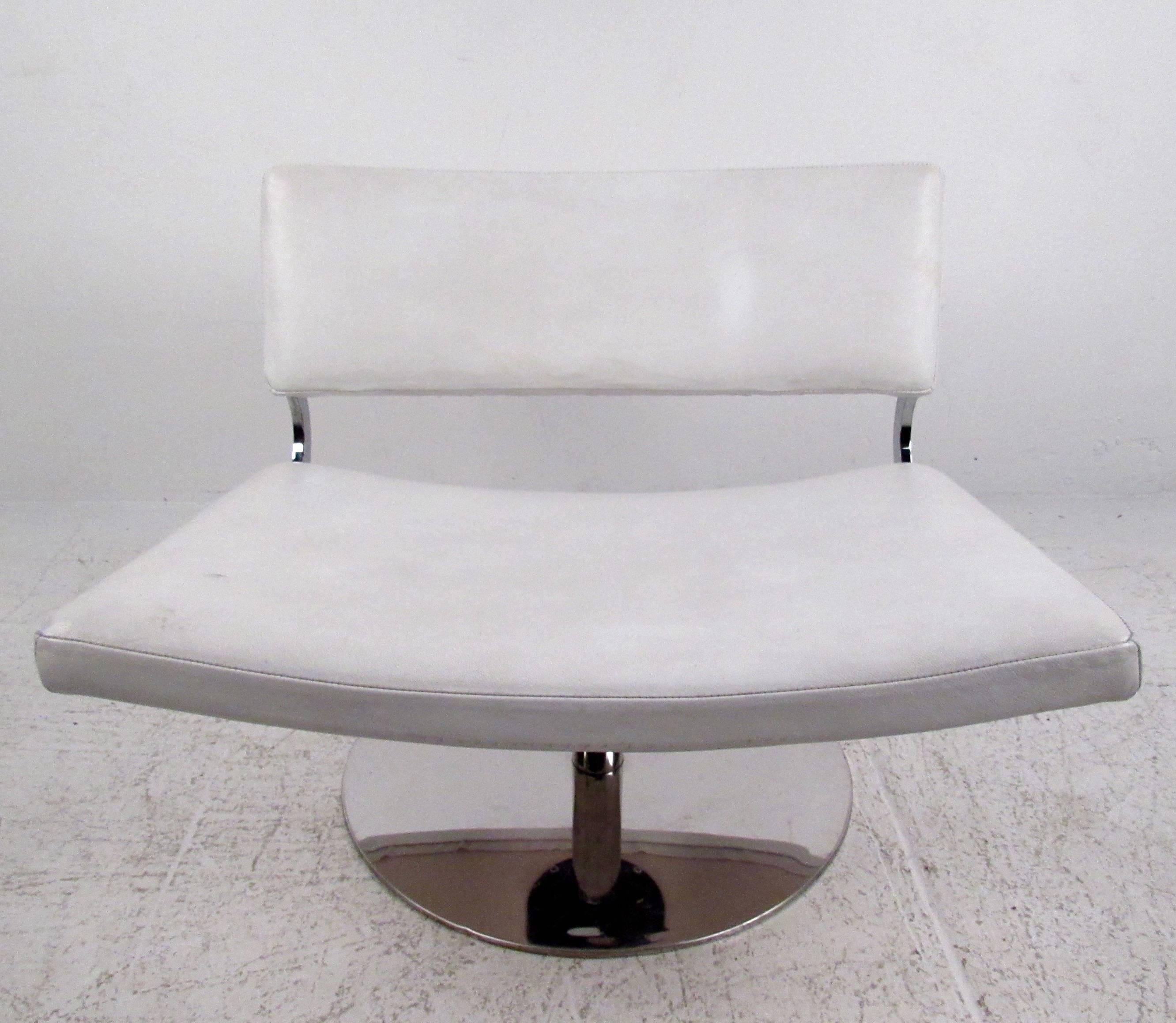 This stylish slipper chair features a chrome swivel base and uniquely wide seat. Perfect lounge chair for any modern interior, the mix of leather and chrome makes a wonderful addition to home or office. Please confirm item location (NY or NJ).