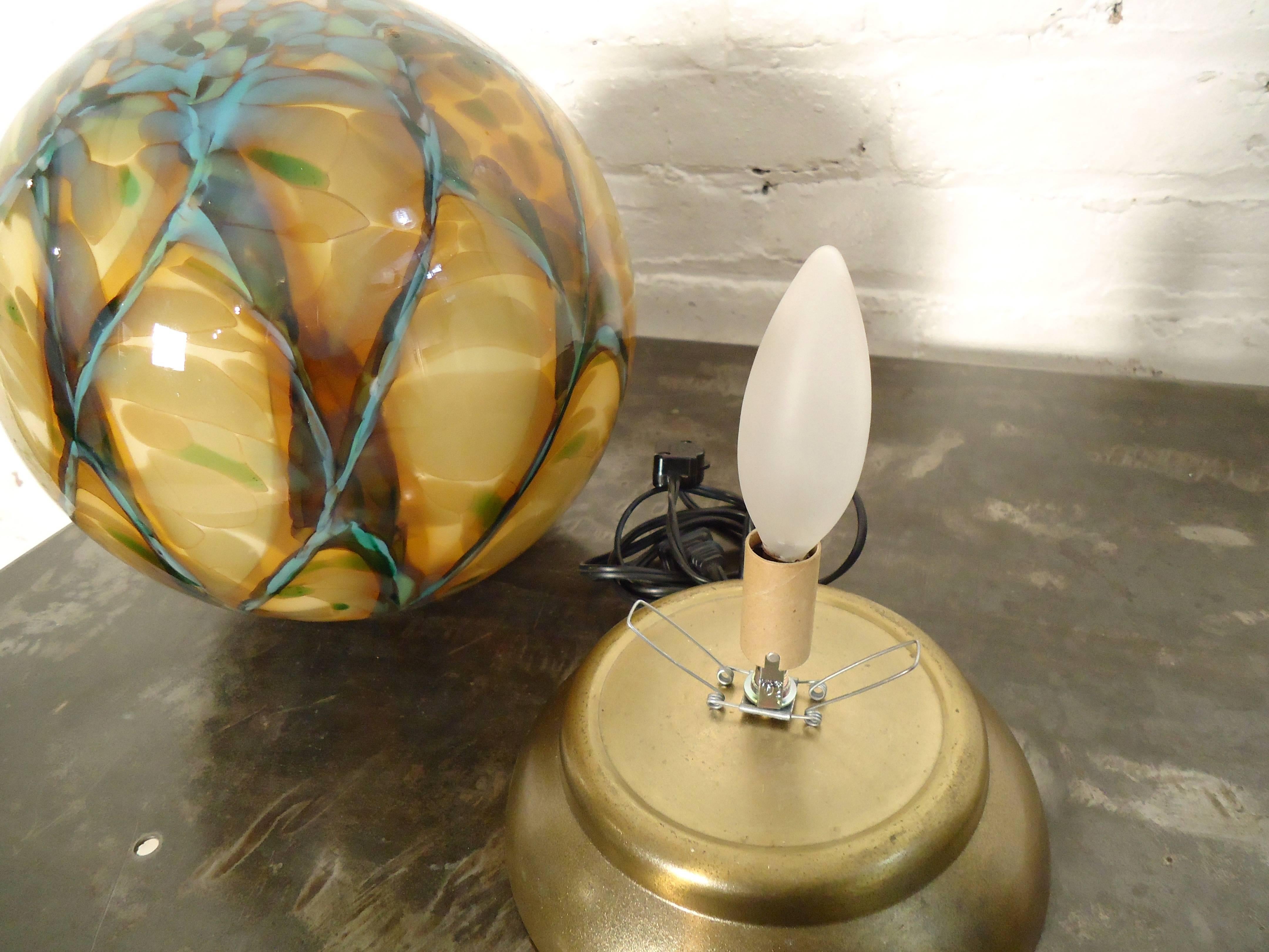 Very unusual vintage modern sphere table lamp, features a very colorful stained marble glass design.

(Please confirm item location NY or NJ with dealer).