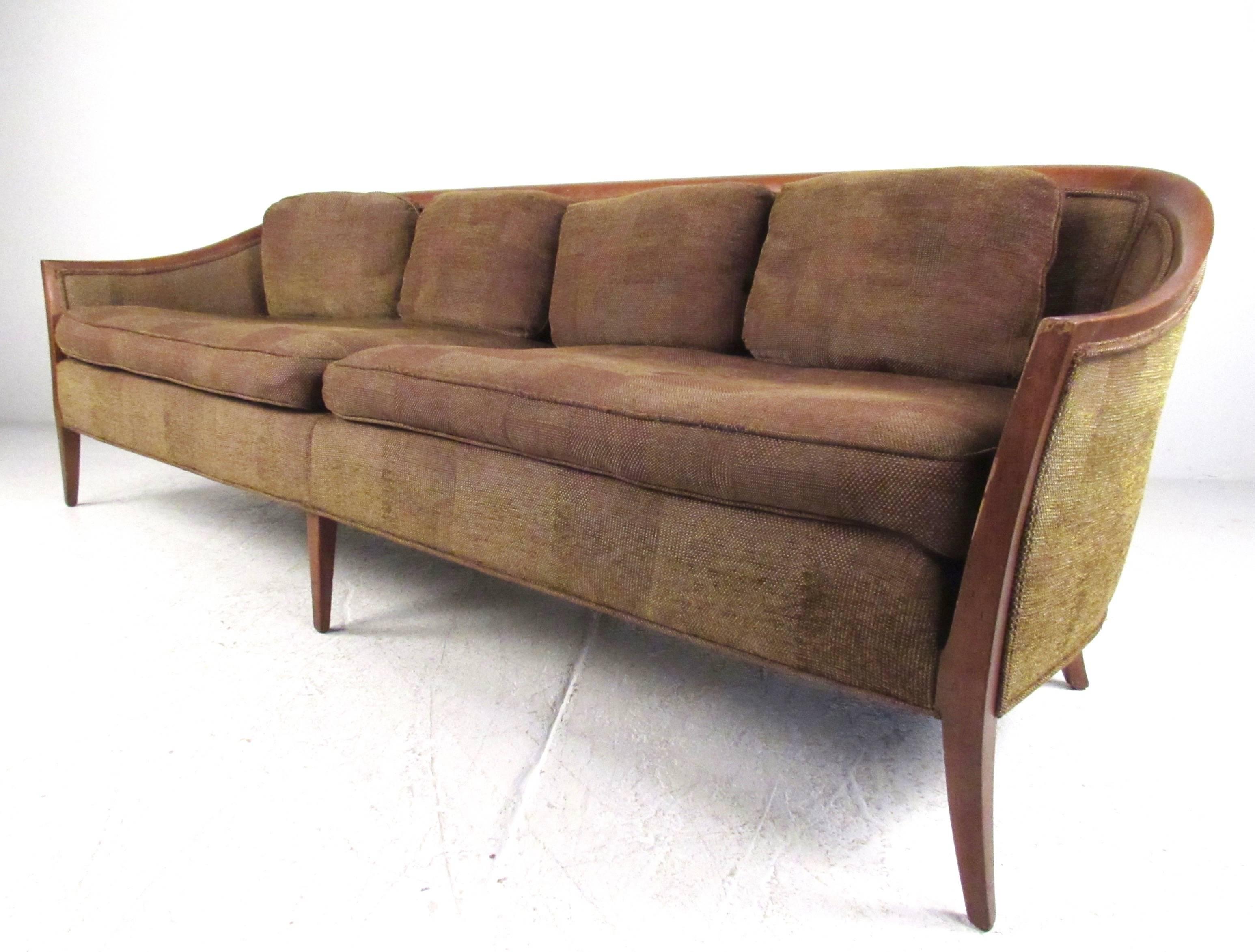 This stylish modern sofa features sculpted hardwood frame with upholstered sides and plush, spacious seating area. Tapered six leg design adds stability and style to this lovely sofa by John Stuart Inc. Please confirm item location (NY or NJ).