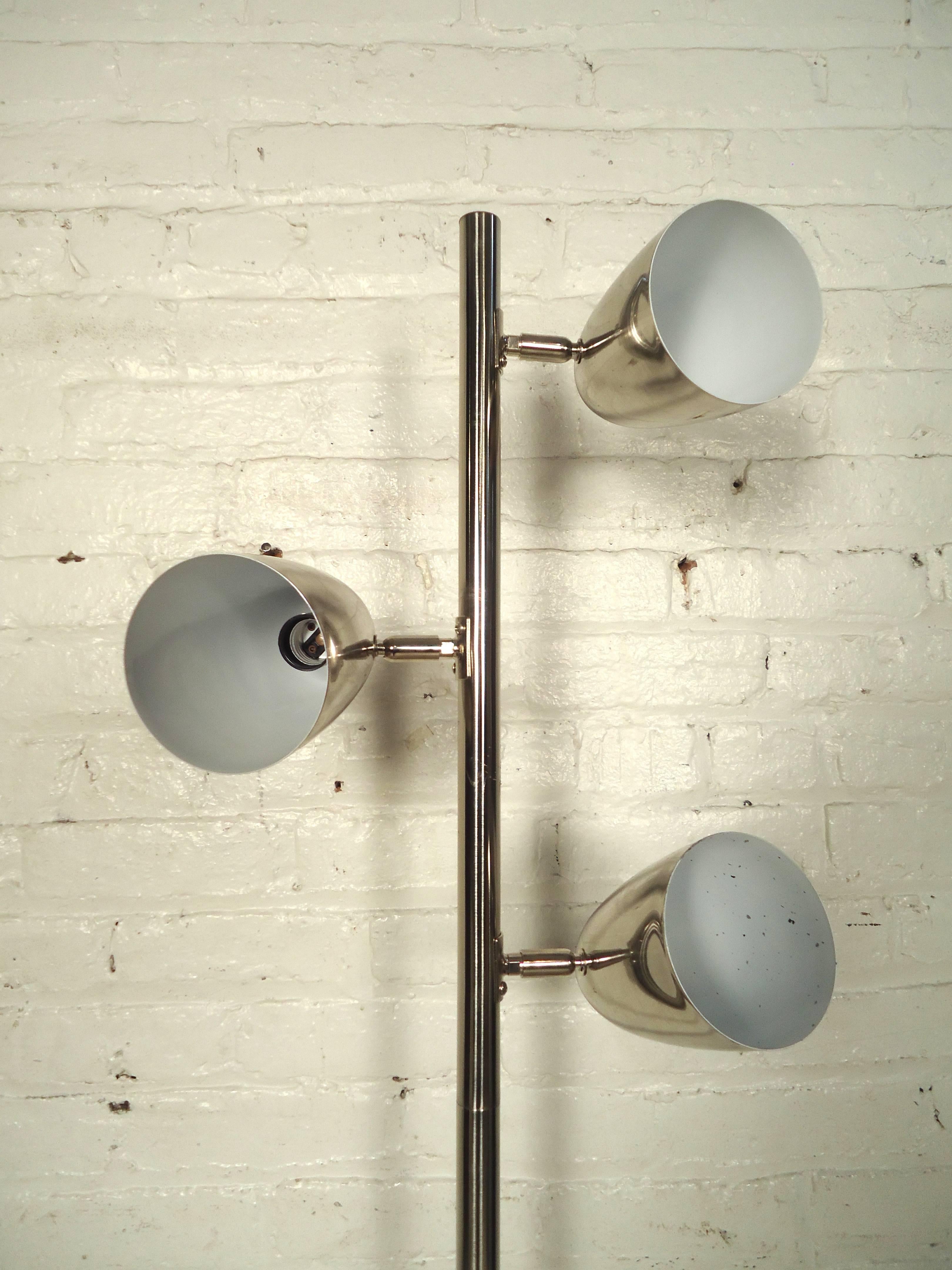 Mid-Century style chrome floor lamp in polished chrome. Features three movable lamps and sturdy base.

(Please confirm item location NY or NJ with dealer).
                                  