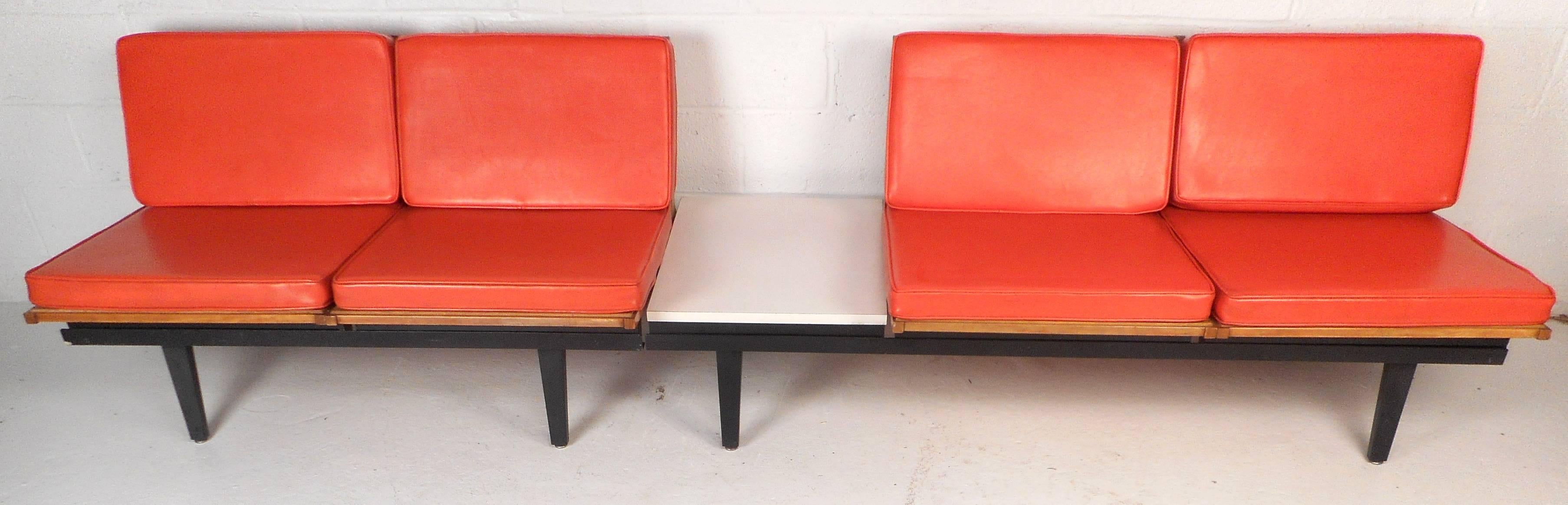 Extremely unique vintage modern lounge chair unit features numerous parts and components and is completely interchangeable. Impressive design by George Nelson for Herman Miller has thick padded orange vinyl cushions, four fold up wood frames, two
