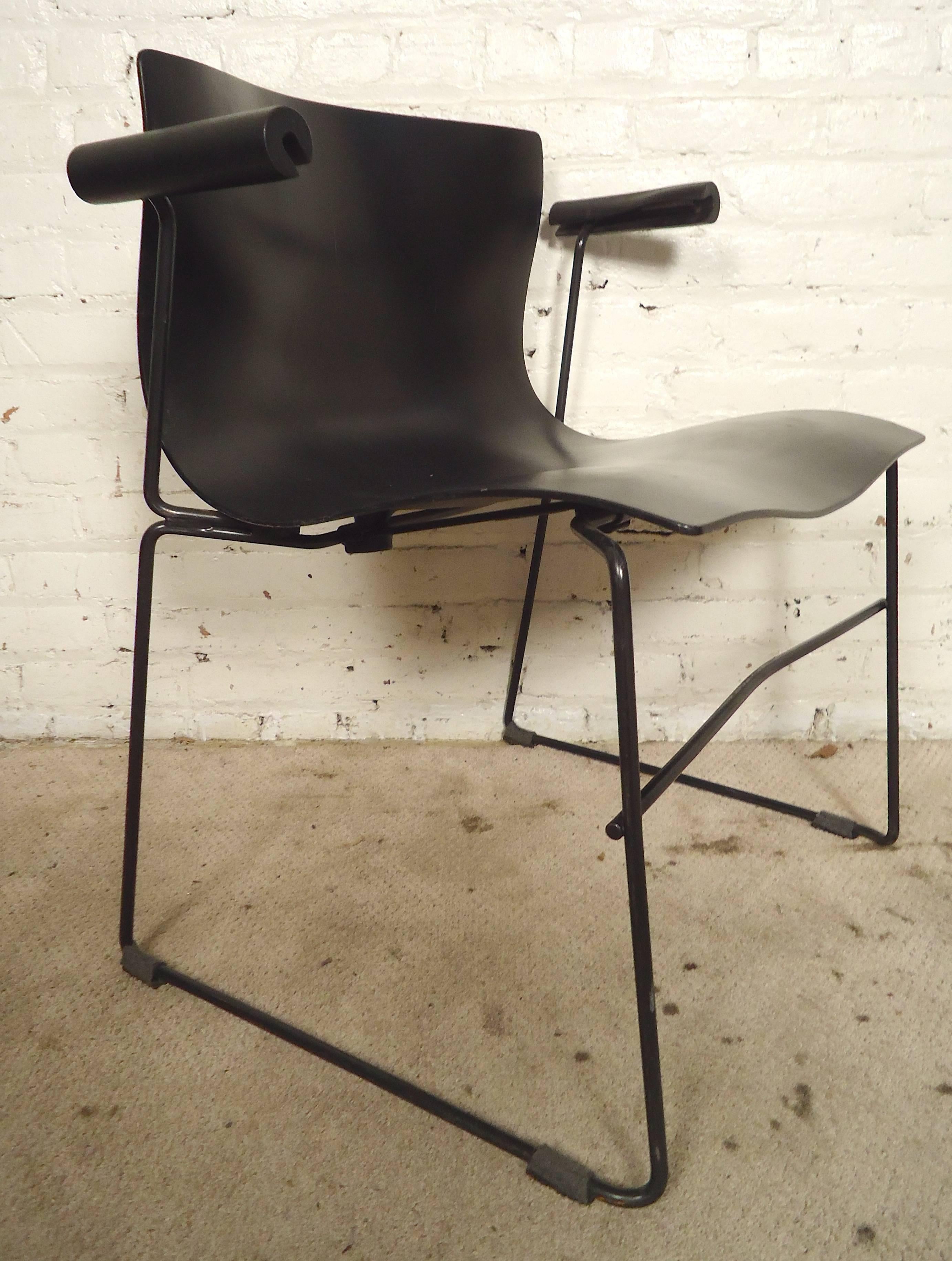 Set of black polyurethane chairs set on thin metal frames. Lovely 