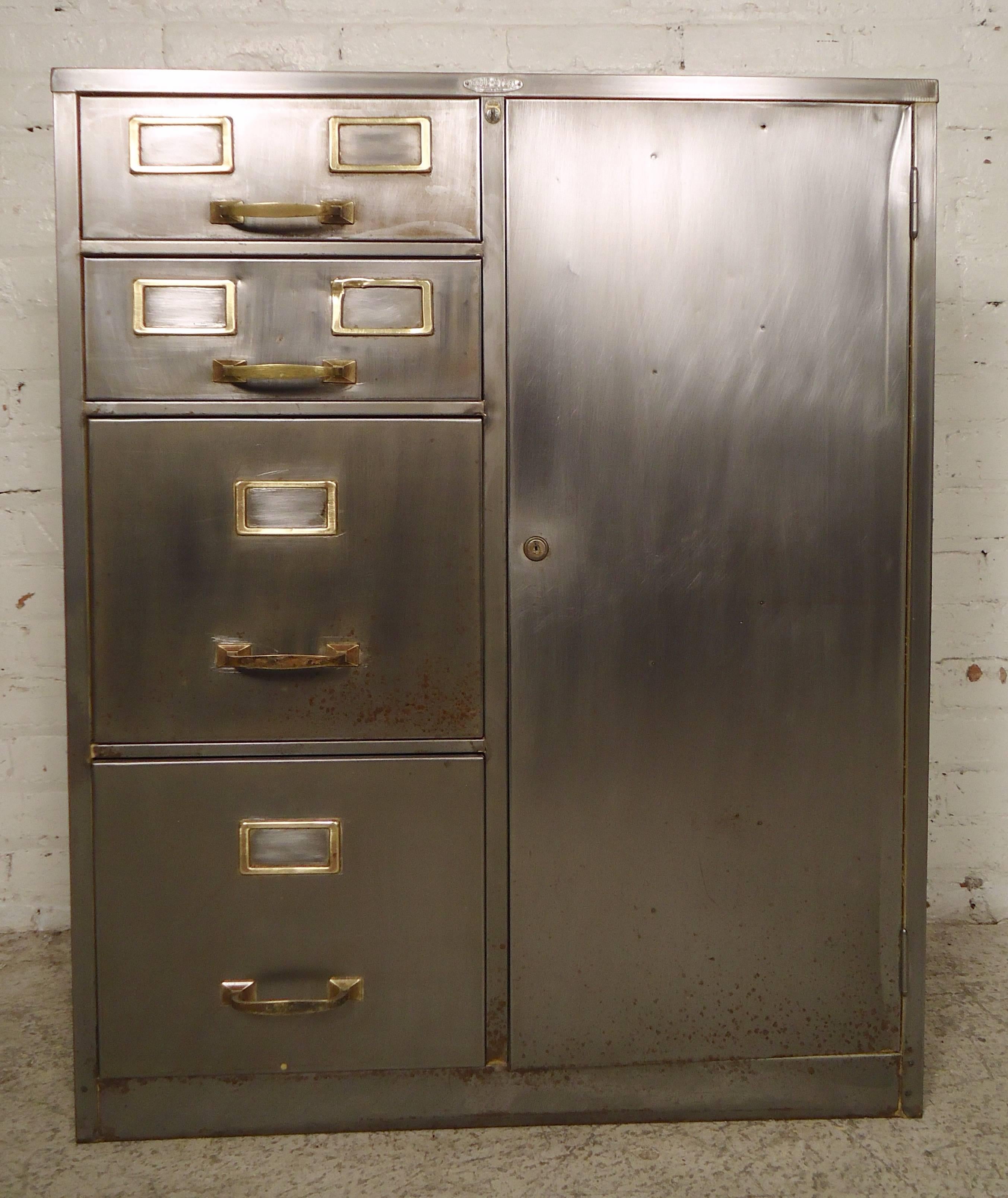 Restored vintage metal cabinet with filing and cabinet storage. Has been refinished in a bare metal style finish with accenting brass hardware.

(Please confirm item location NY or NJ with dealer).
 