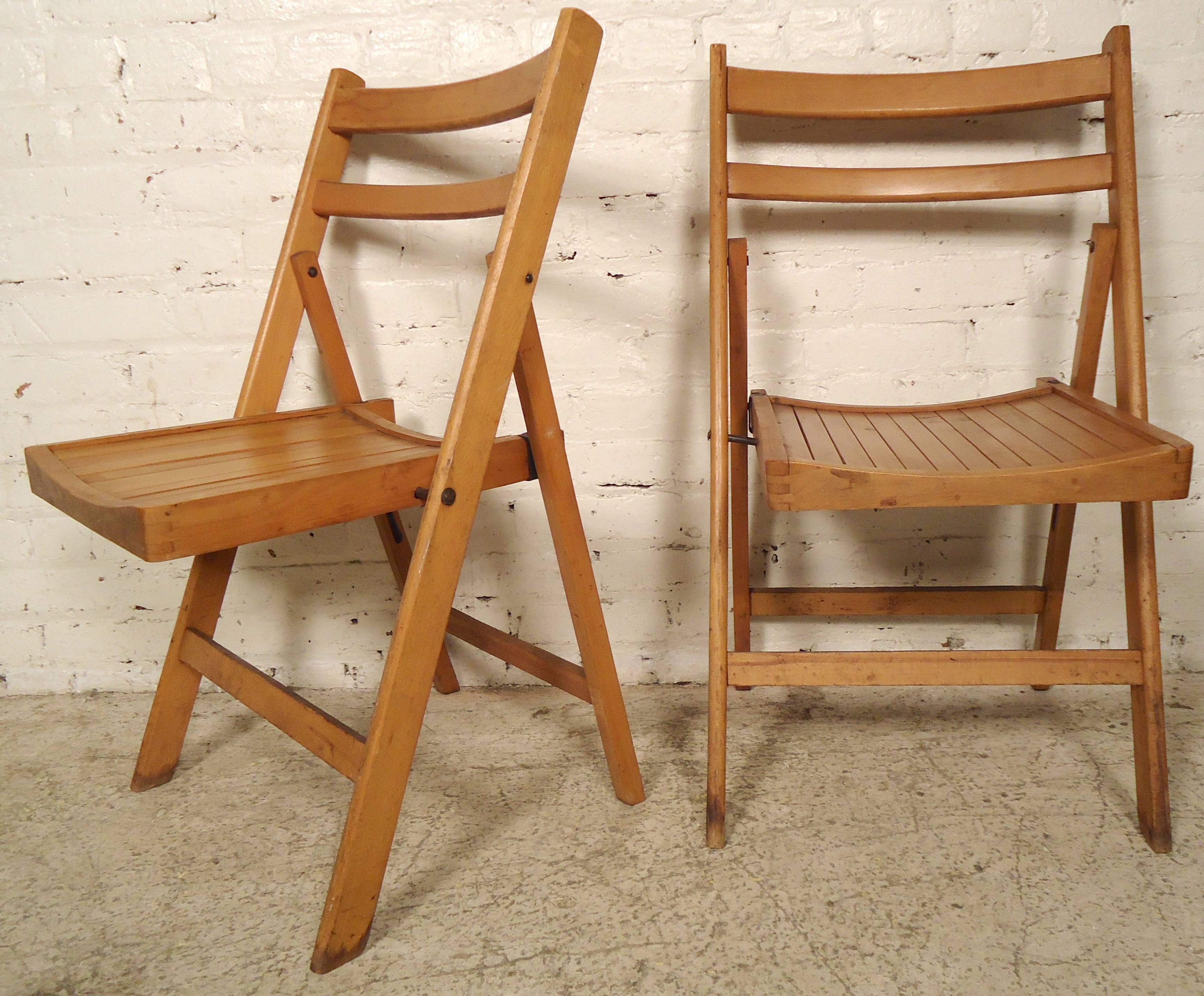 These collapsible chairs feature a slat seat, curved back and sturdy construction. These vintage church hall chairs would be functional in any modern restaurant, bar or dining room. Measuring 2" when folded.
More chairs available.

(Please