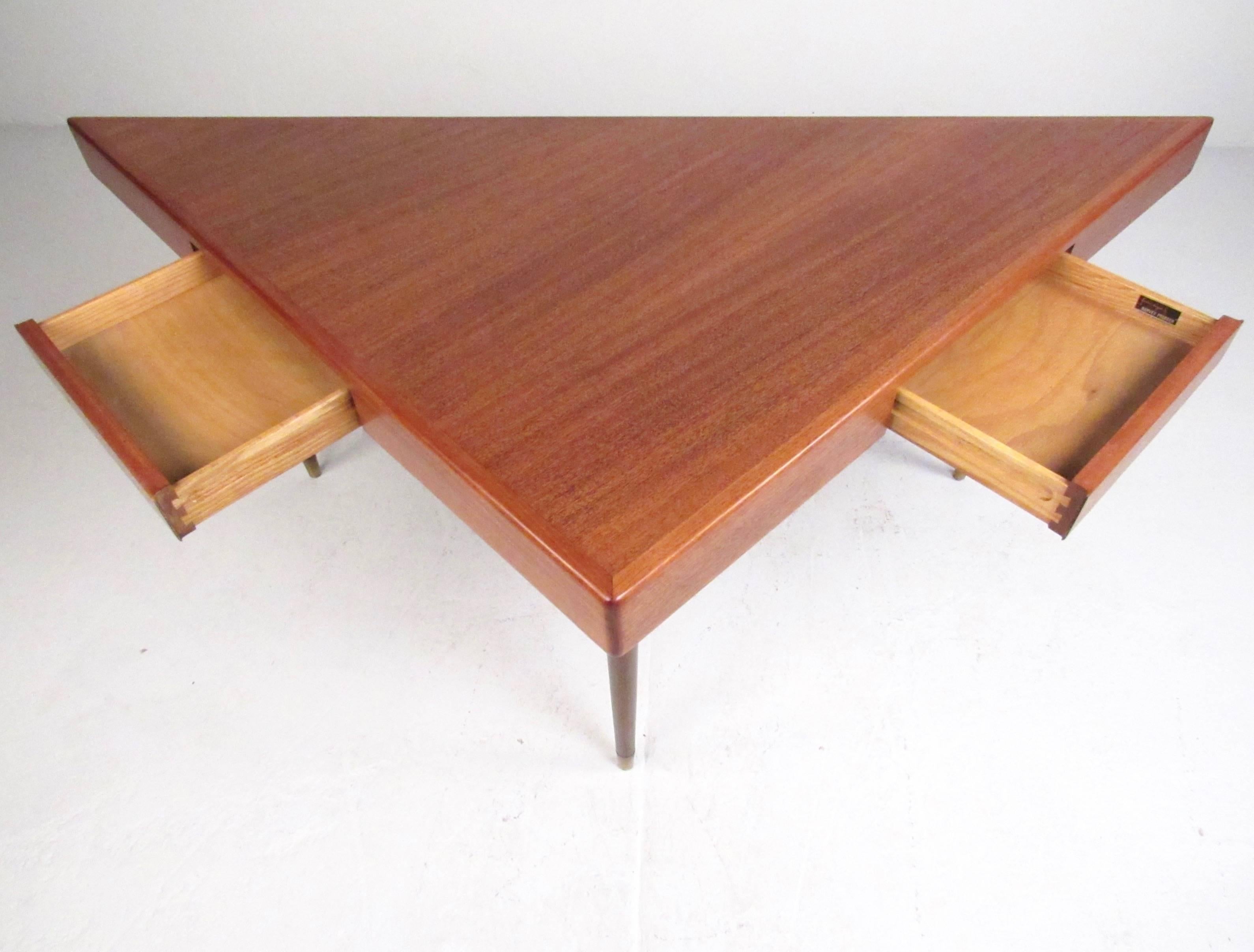 This unique vintage teak console table makes a stylish Mid-Century addition to any interior setting. Whether used as a sofa table, console, or writing desk this impressive piece makes a distinguished addition to any interior. High quality