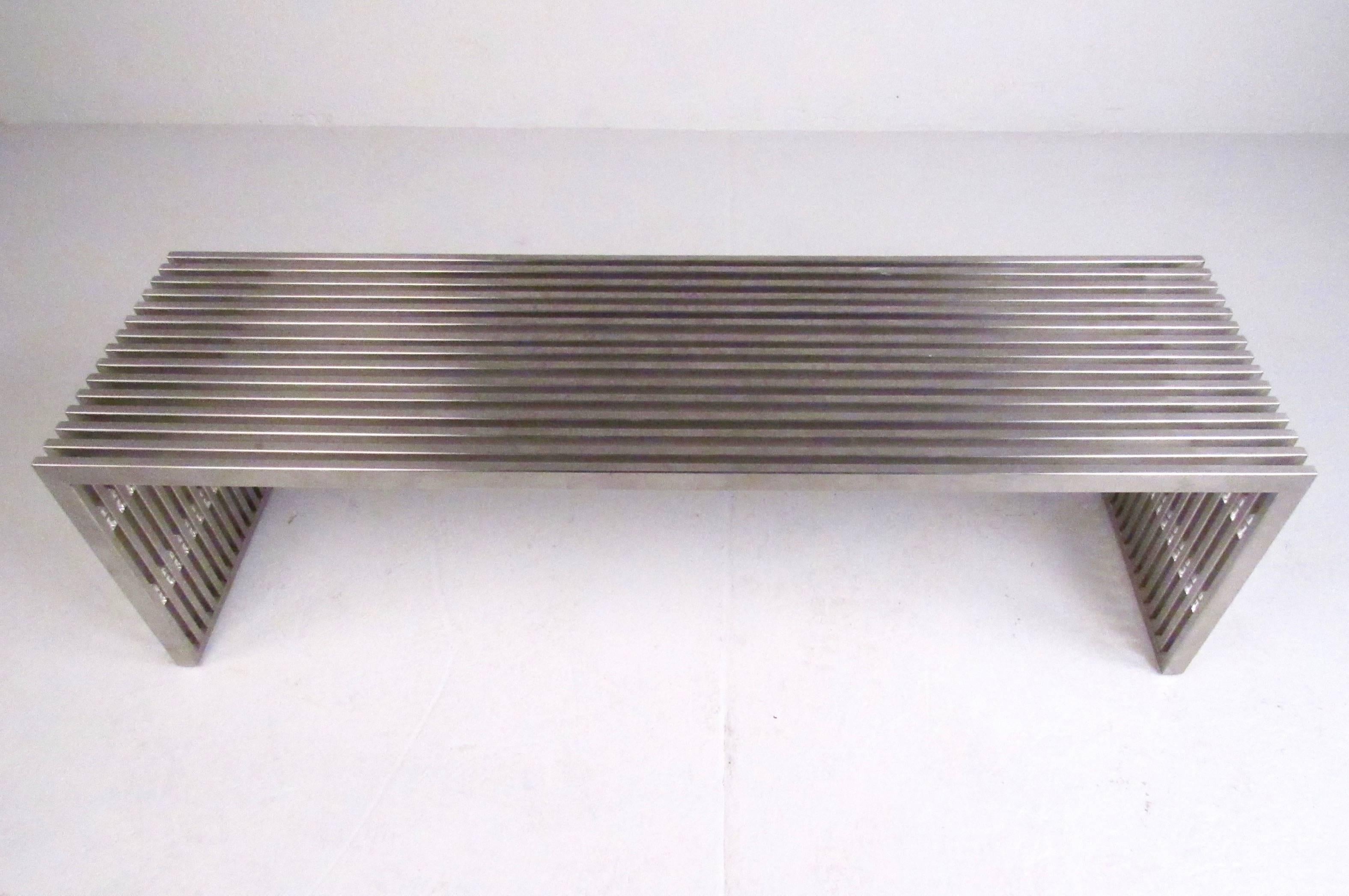 This exquisite Milo Baughman bench features chrome slat construction with unique Lucite spacers. Sturdy and stylish, this piece makes an impressive centre coffee table or sturdy bench for occasional seating. Please confirm item location (NY or NJ).