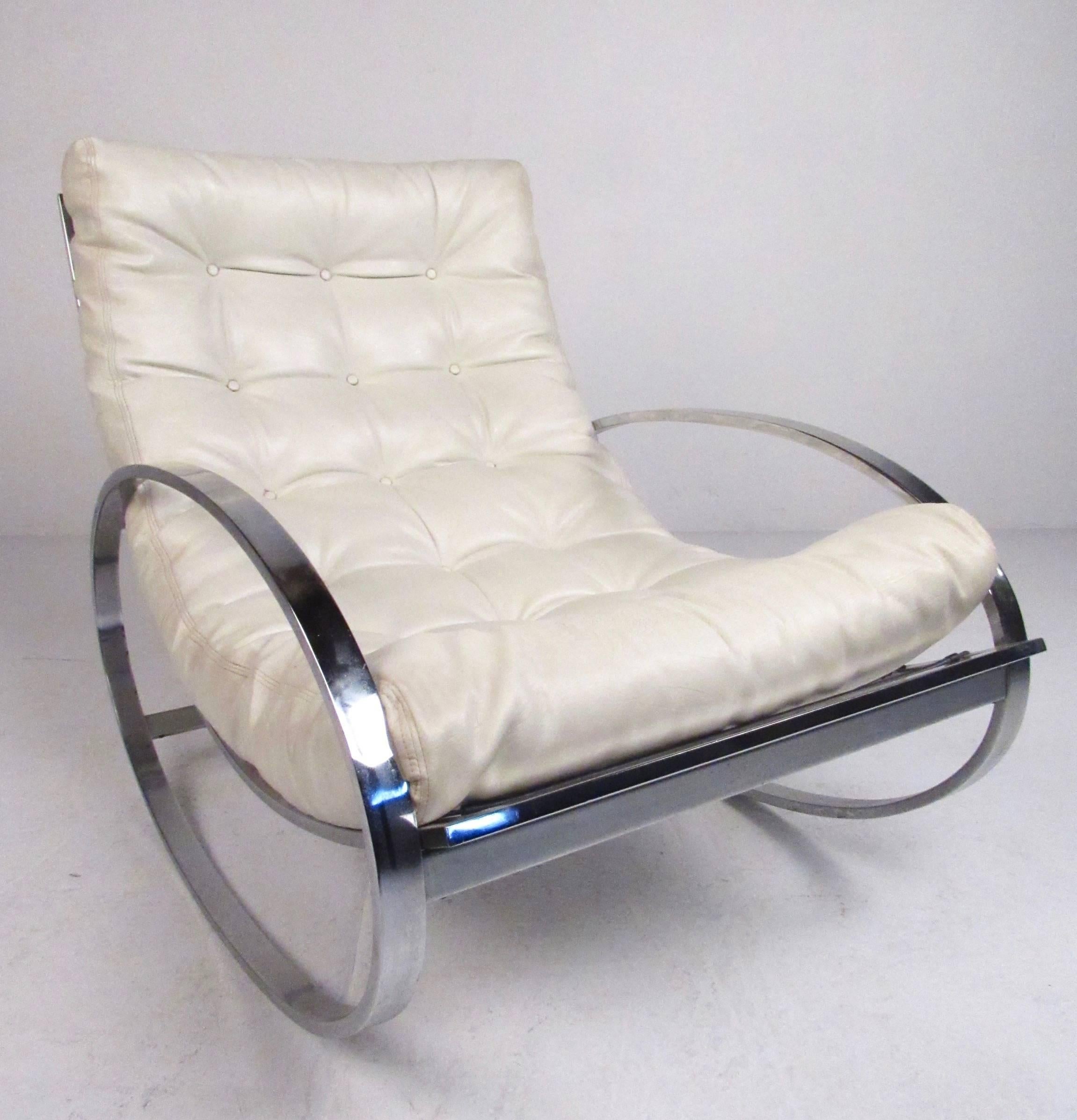 This stylish chrome and vinyl rocker by Renato Zevi for Selig takes some cues from the style of mid-century master Milo Baughman while maintaining it's own unique feel. Substantial chrome construction, plush tufted vinyl upholstery, and