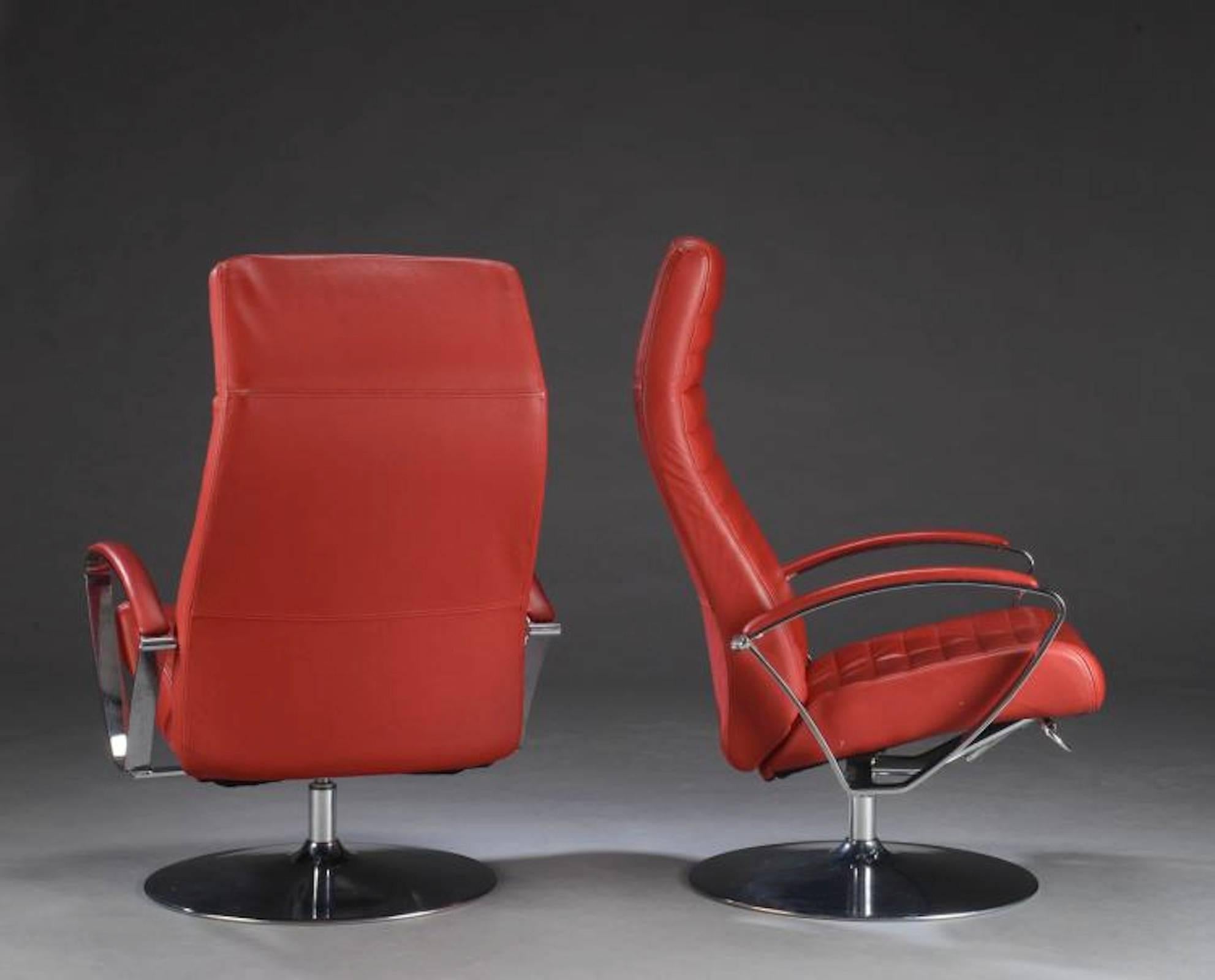 Sleek leather chairs with chrome arms and unusual round chrome base. Adjustment bar on base, covered arm rests, comfortable leather seats.

(Please confirm item location with dealer).
  