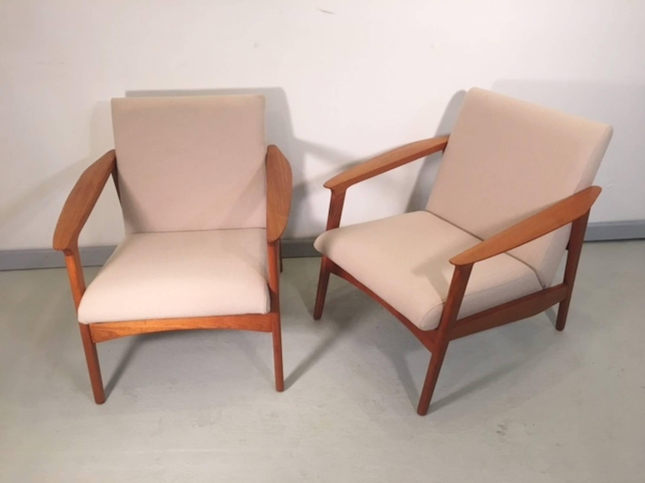 Vintage modern lounge chairs with sculpted teak frame and thick cushioning. Stamped with Danish makers mark.

(Please confirm item location with dealer).
 