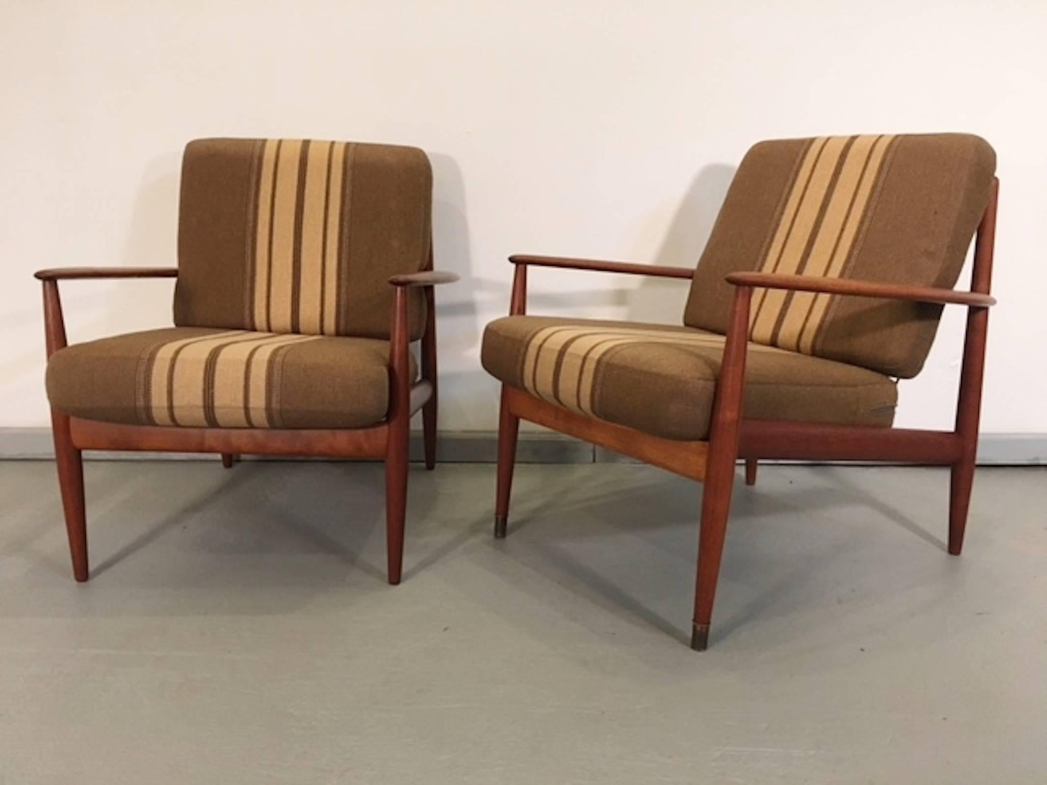 Vintage Danish chairs designed by Grete Jalk. Featuring long arms, tapered legs and rope or banded seat and back.

(Please confirm item location with dealer).
 