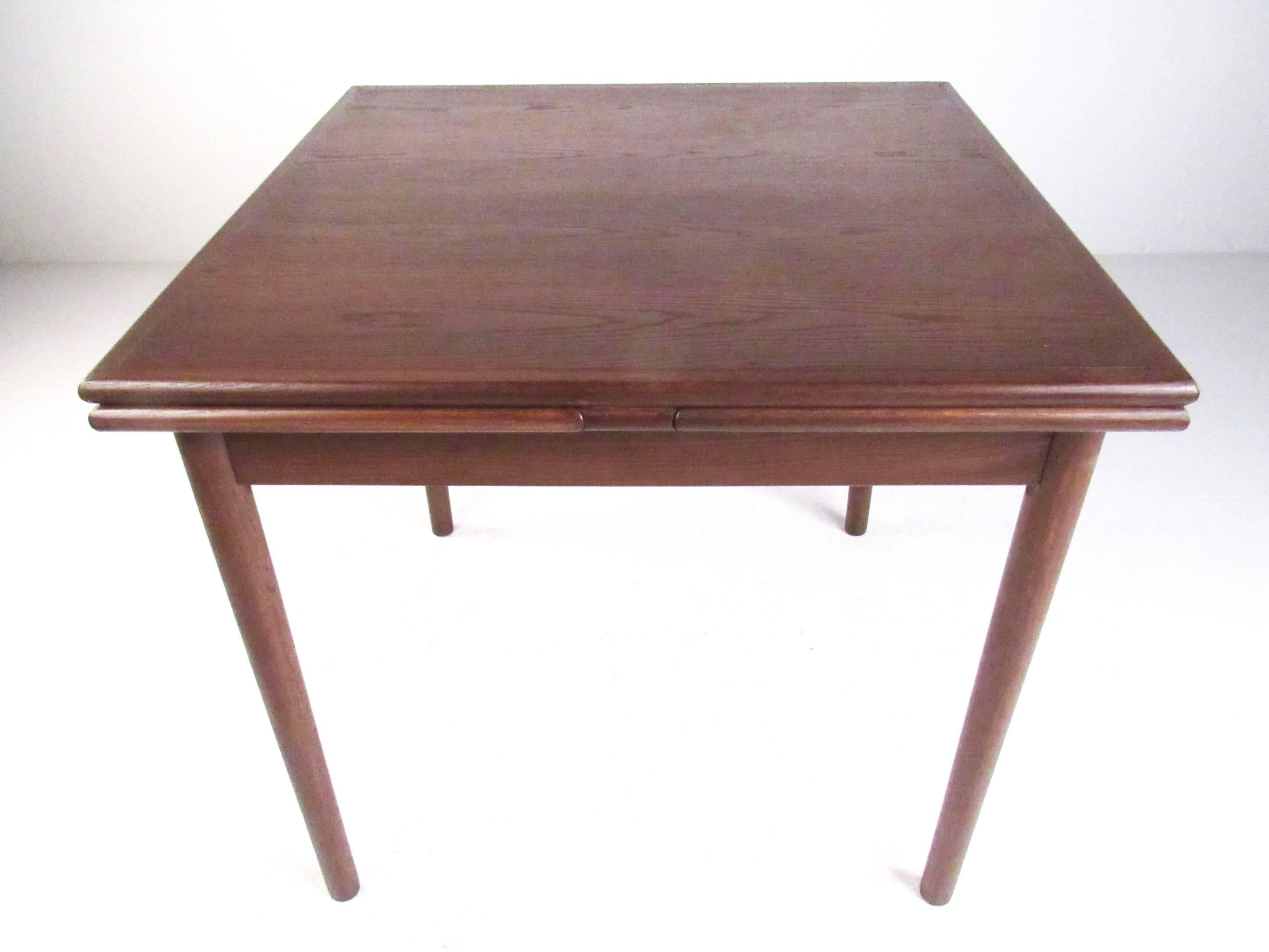 This small-scale dining table is perfect for crowded spaces, the versatility of the draw leafs make's it easy to tuck out of the way or open up for company. Vintage teak finish adds Mid-Century Scandinavian style to any interior, please confirm item