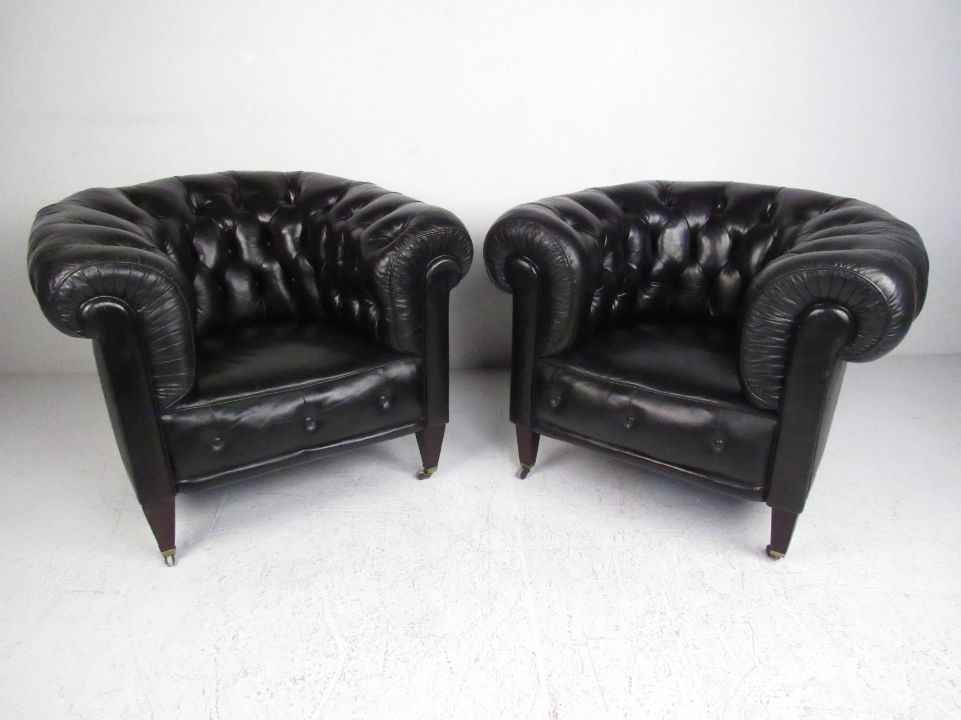 This gorgeous matching set of black leather chesterfields includes a three seat sofa and a pair of overstuffed lounge chairs. Unique proportions, thick scrolled arms, and comfortable tufted upholstery add to the vintage charm and timeless comfort of