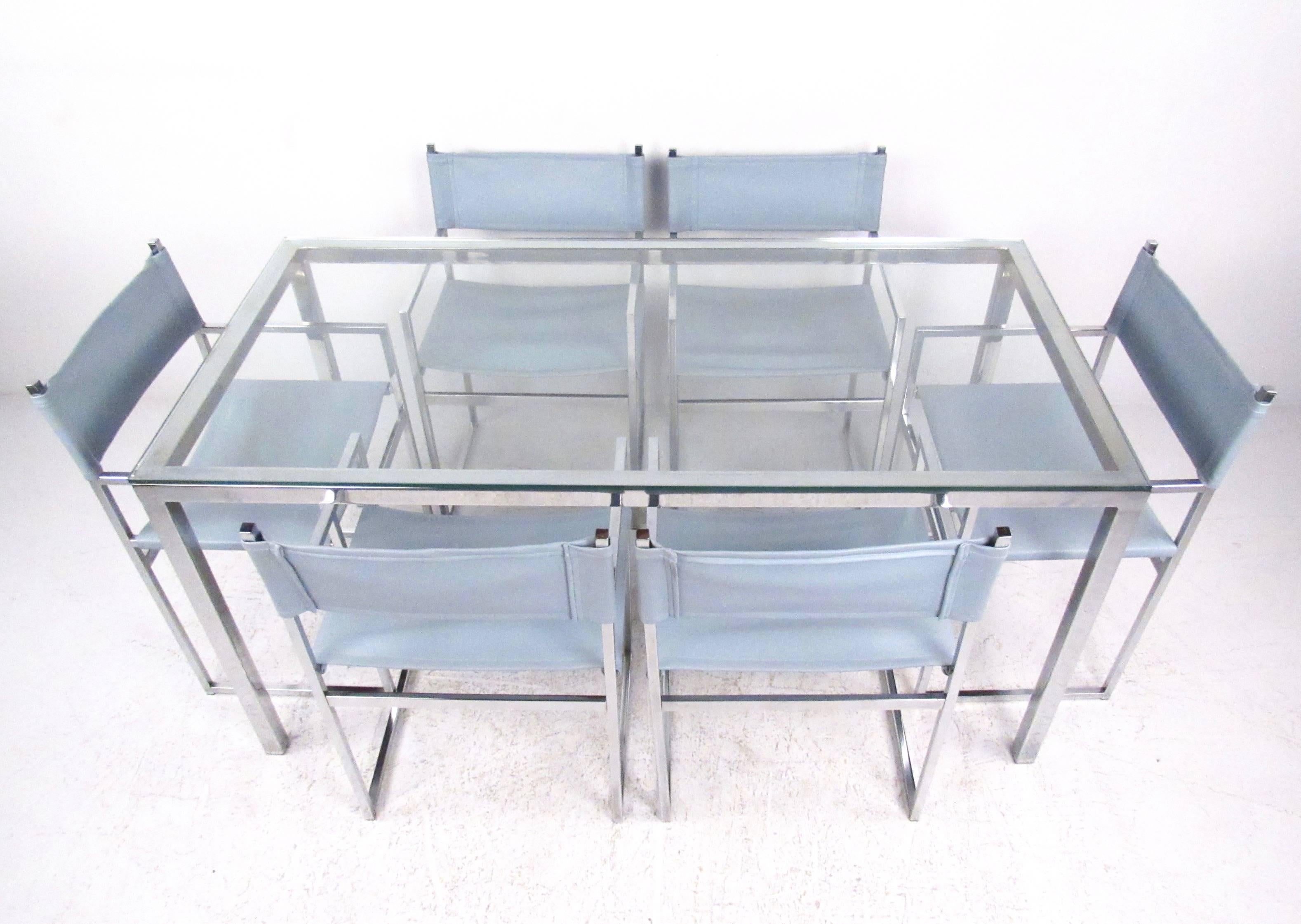 This stylish vintage chrome dining set includes six matching Stendig style chairs with matching chrome frame dining table. Making a beautiful mid-century modern statement in any setting, this glass top table makes a spacious eating or meeting space
