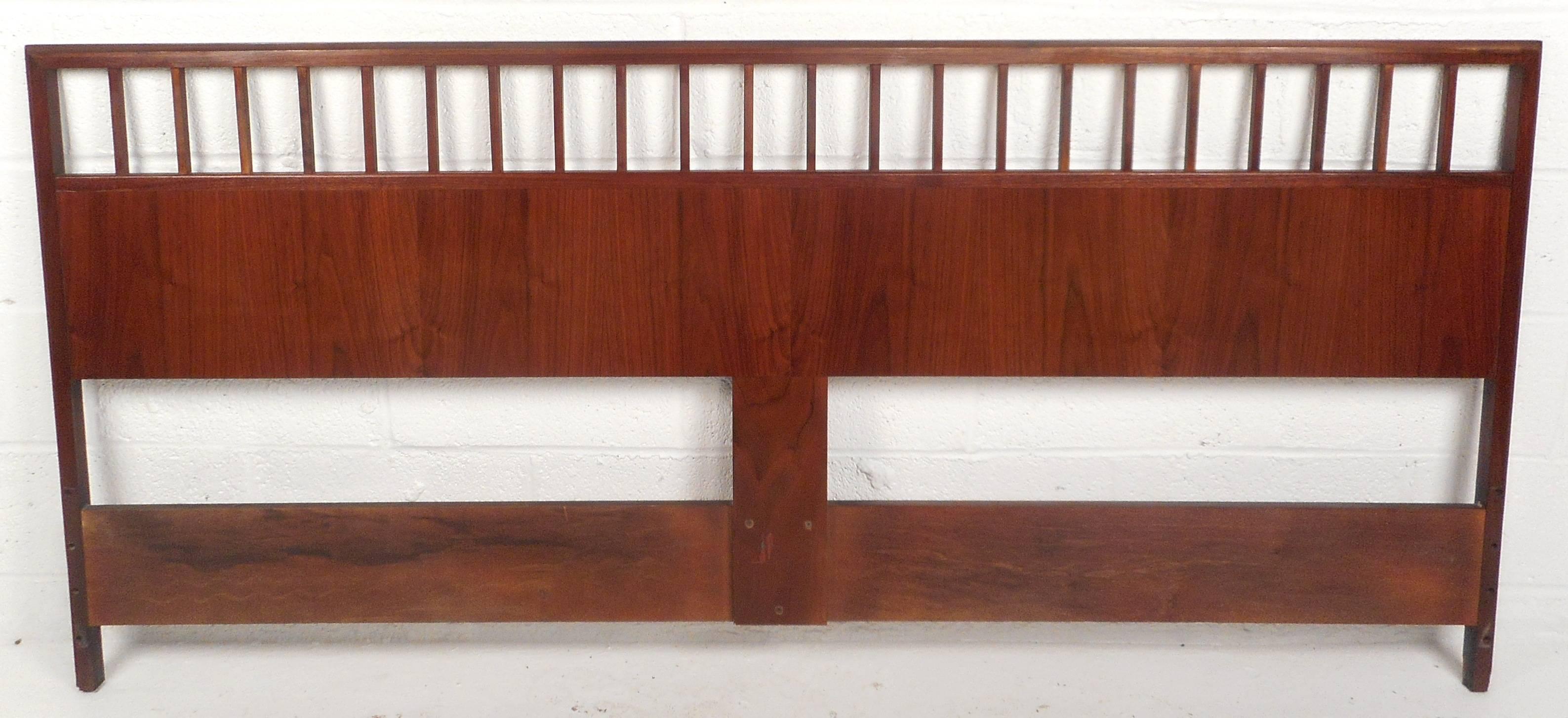 This impressive vintage modern headboard features beautiful walnut wood grain and a unique spoke design top. The sturdy construction and sleek appearance make this Mid-Century piece the perfect addition to any setting. Please confirm item location