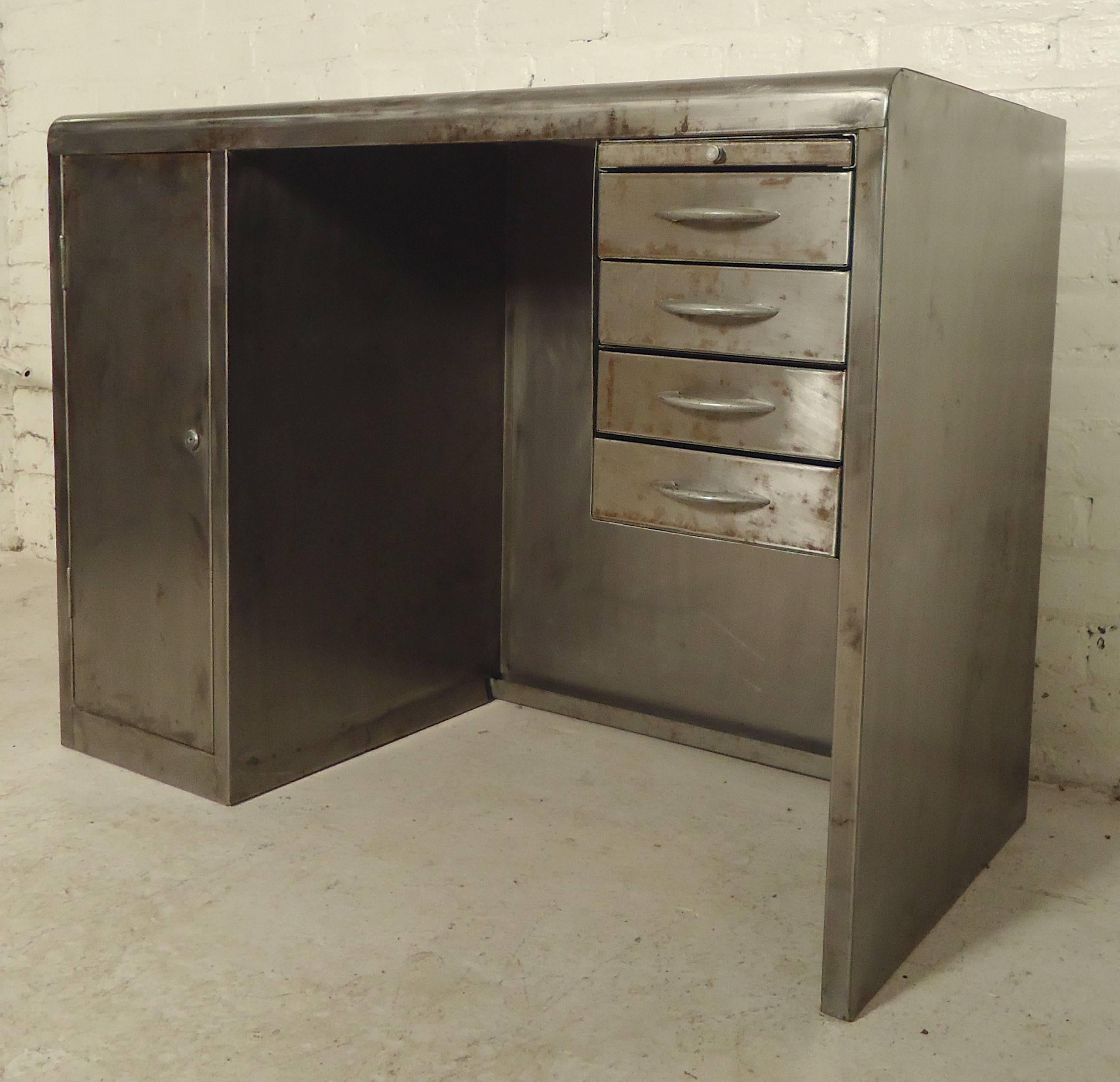 Miniature metal desk refinished in an Industrial base metal style. Long left side cabinet and small right side drawers. Great for children's room or tight loft living.
Kneehole measures: 17.5