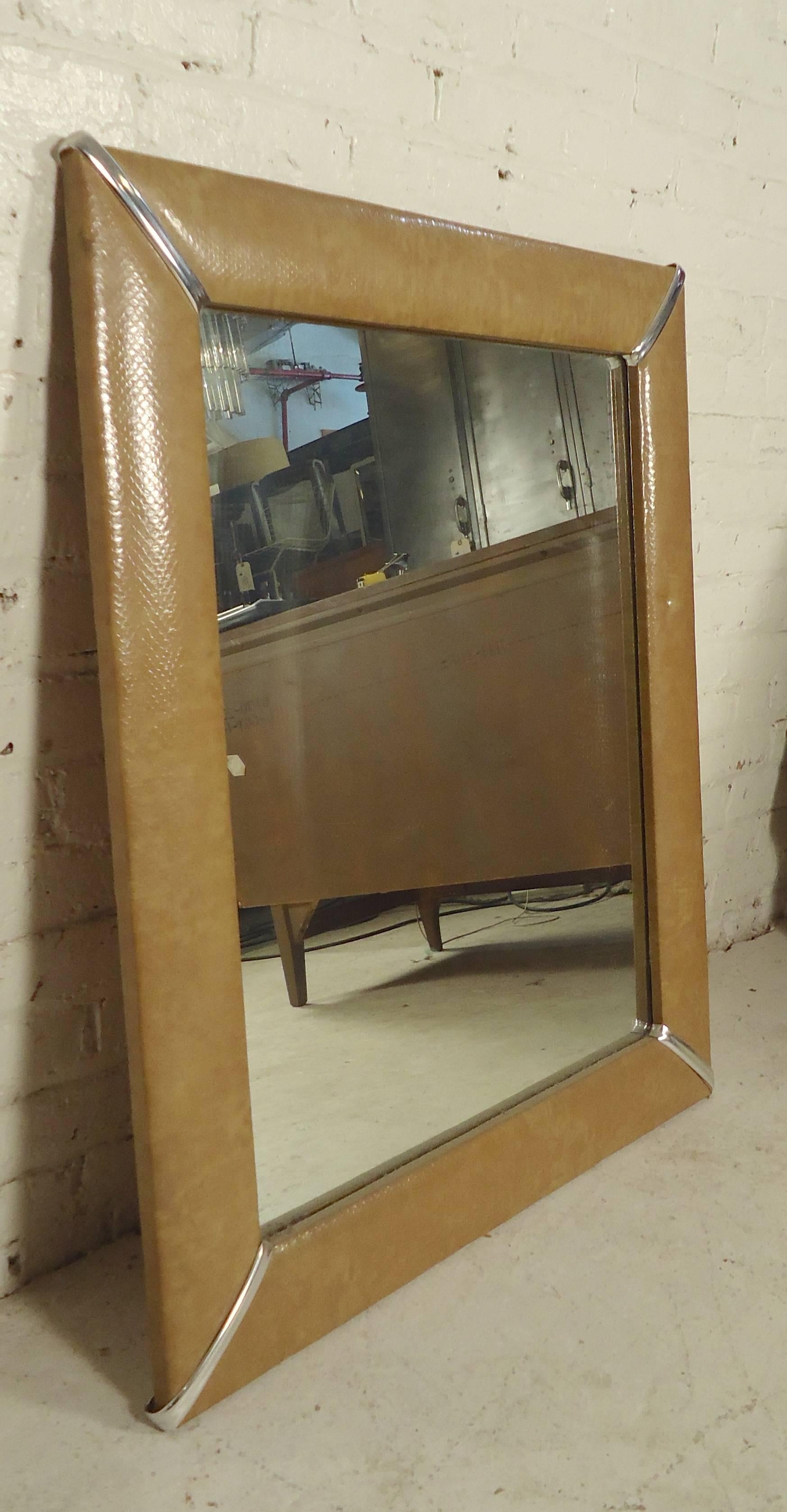 Unique mirror with tan vinyl with snake skin pattern and chrome accents.

(Please confirm item location NY or NJ with dealer).
  