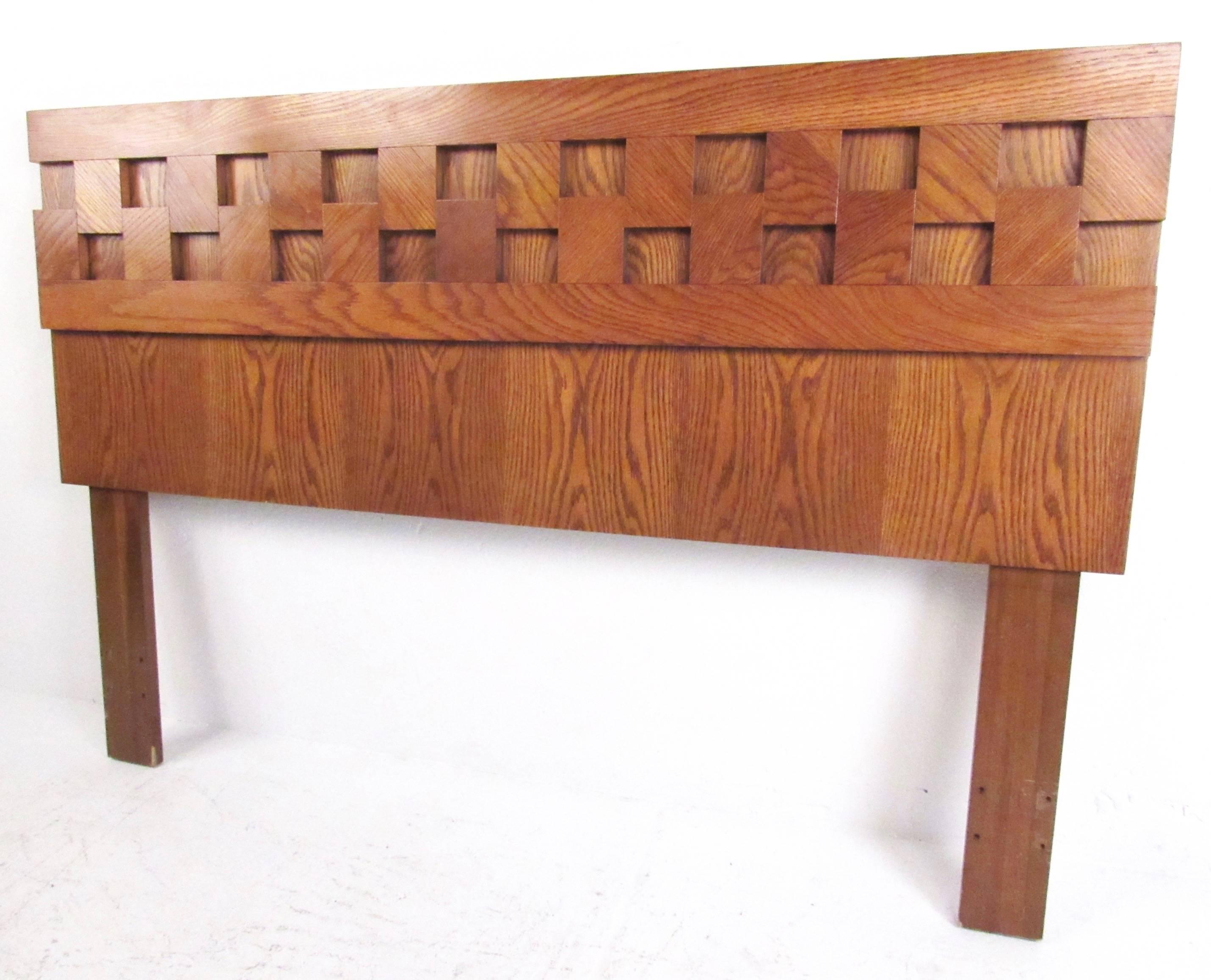 This stylish Brutalist modern headboard features a unique oak finish, sculptural matched grain design, and fits a standard queen-size mattress. Please confirm item location (NY or NJ).