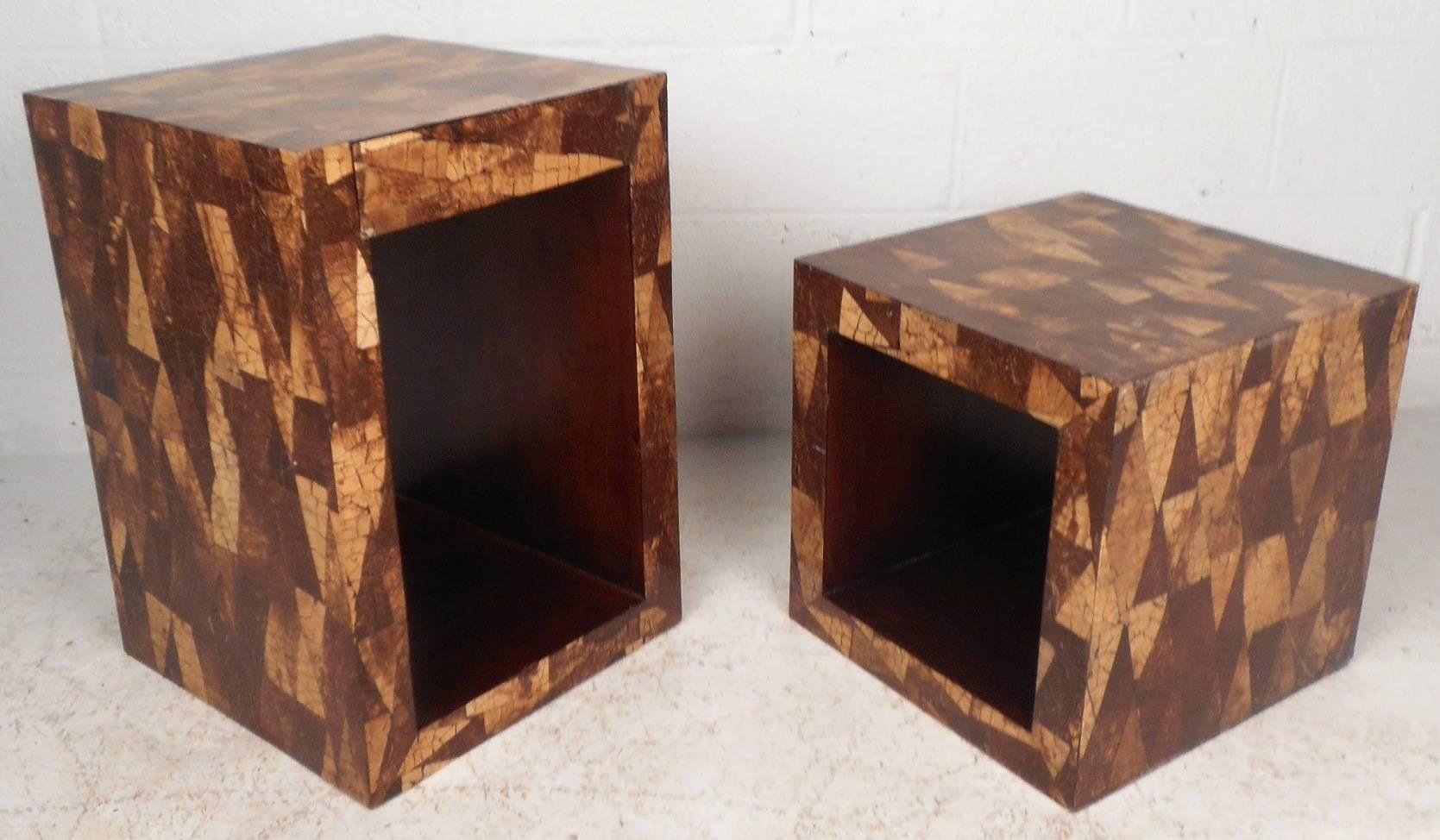 This beautiful vintage modern pair of end tables feature a unique coconut shell inlay design around the exterior. The interior allows room for storage and has gorgeous wood grain to compliment the outside. The larger table has one hidden drawer
