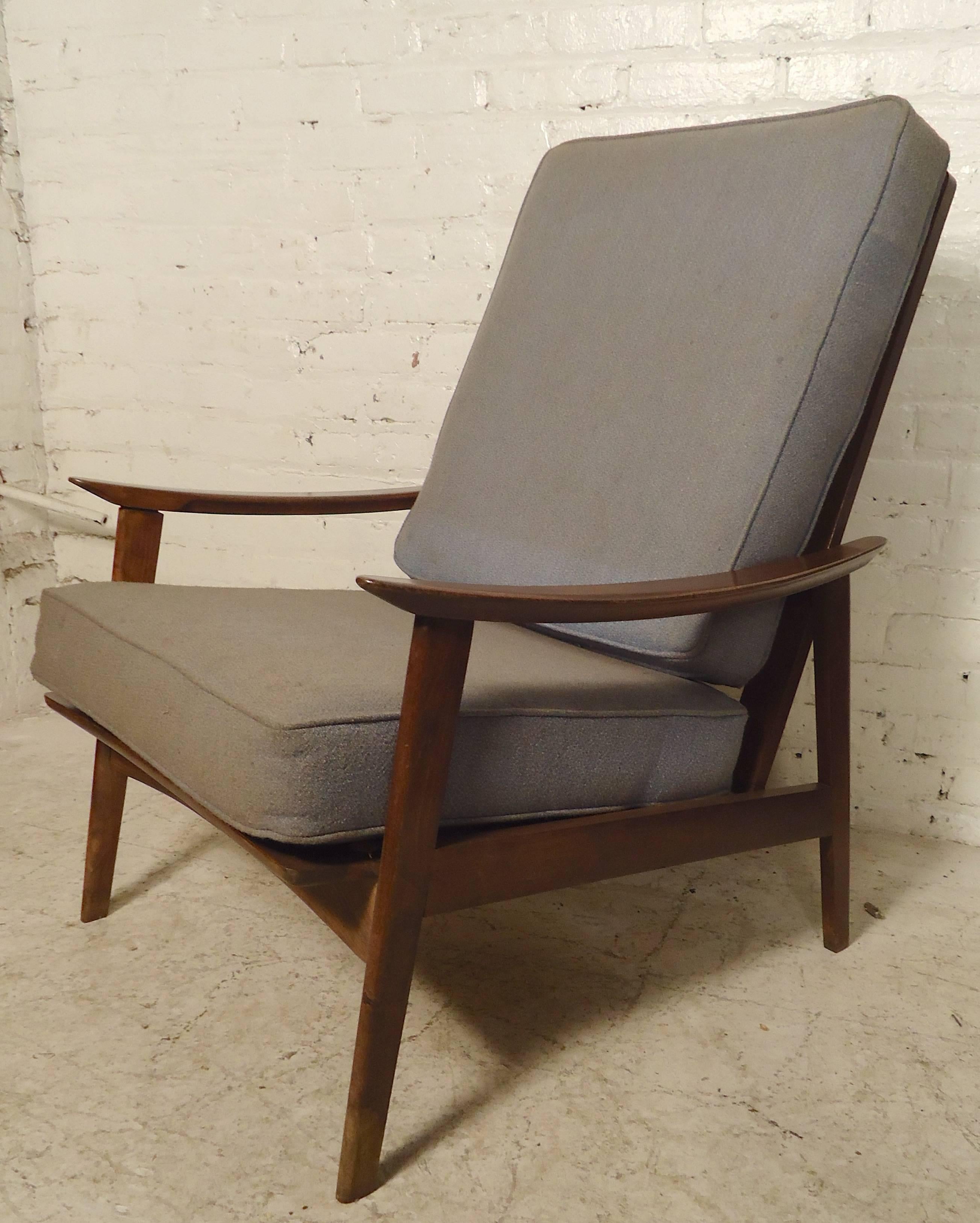 Lovely vintage modern wood frame chairs with sculpted arms, spindle backs and thick cushions. 

(Please confirm item location - NY or NJ - with dealer).
 