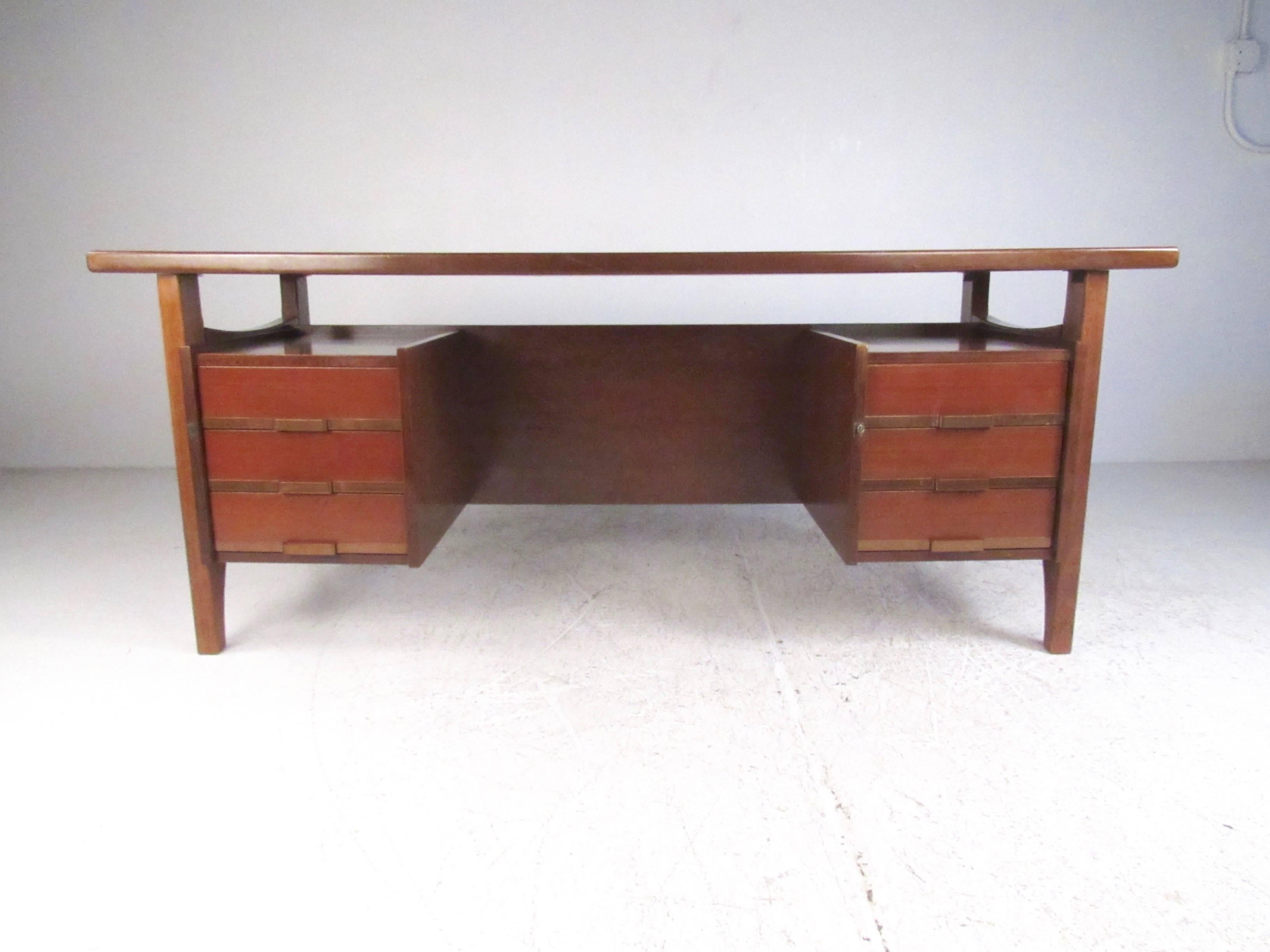 This exquisite mid-century Italian desk by Schirolli features stunning 1960s construction with floating top design in the style of Ico Parisi. Six spacious drawers offer plenty of locking storage, while double sided design makes this Mid-Century