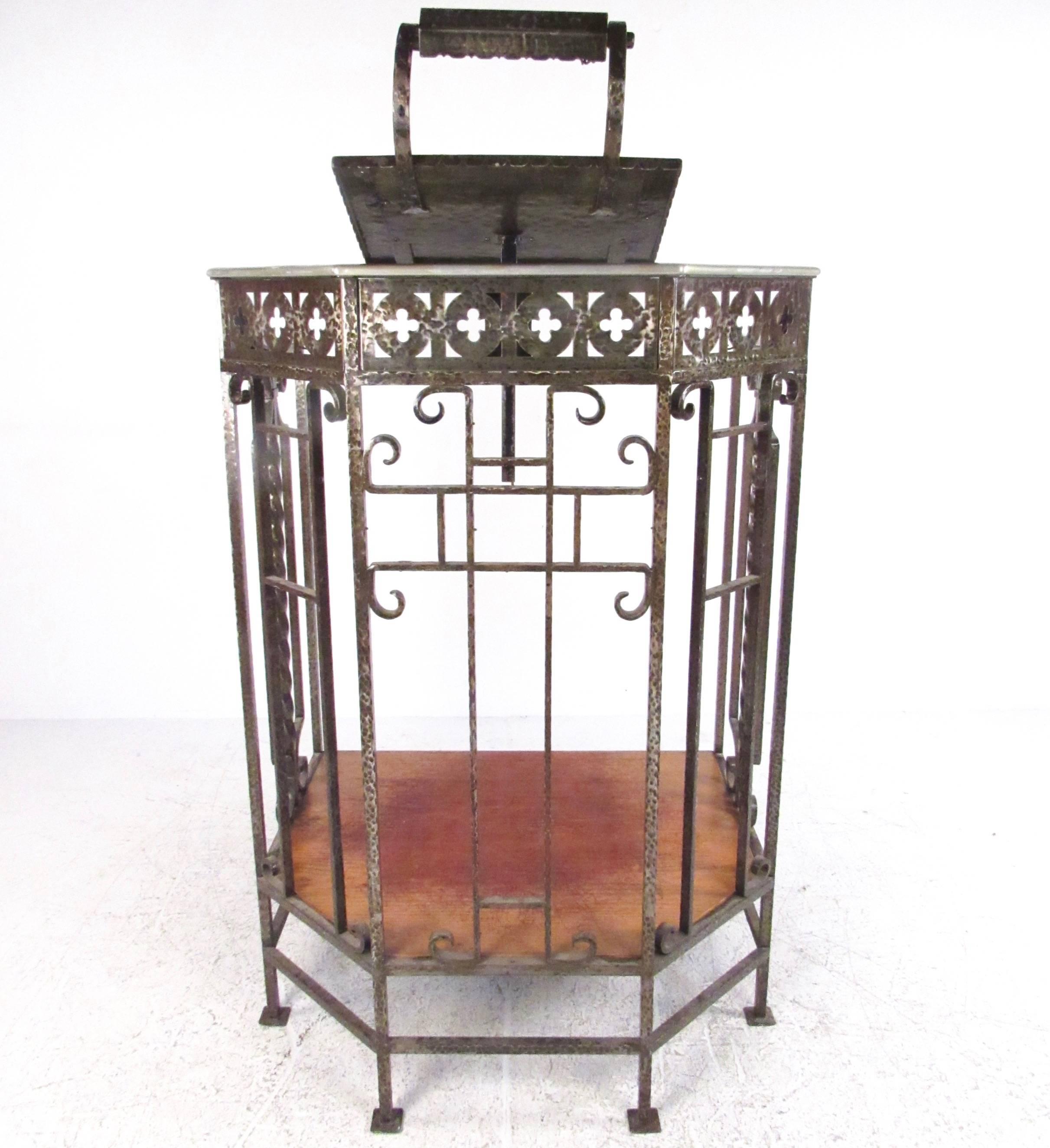 This truly unique cast iron podium features ornate scrolled metal design, removable lectern with light, and hard wood platform with step. This one piece podium was originally used a speaking lectern, but would make an impressive addition to any