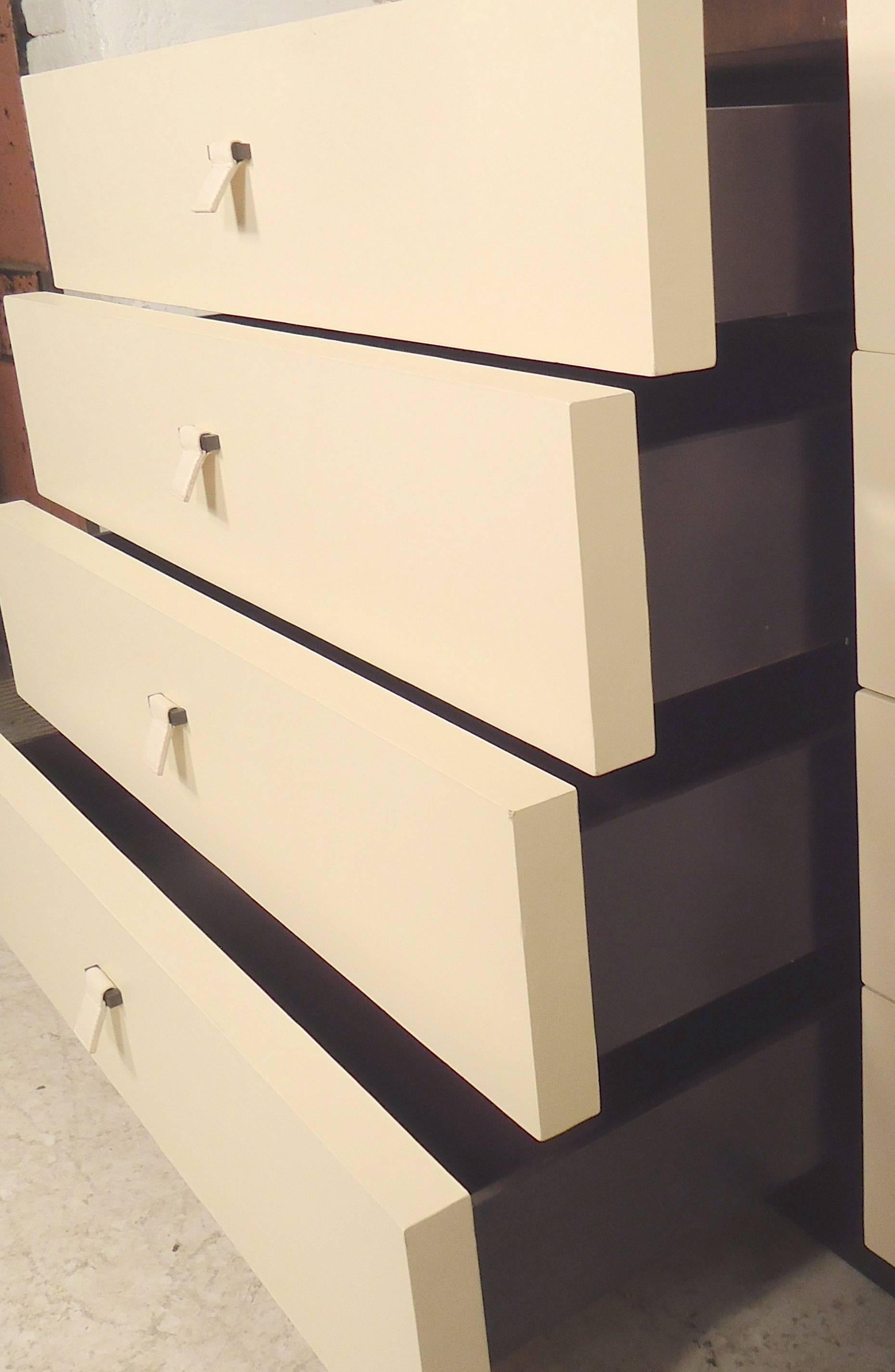 Vintage eight-drawer dresser with an off-white leather front and dark mahogany color wood. Drawers are deep and wide with leather pulls.

(Please confirm item location NY or NJ with dealer).
             