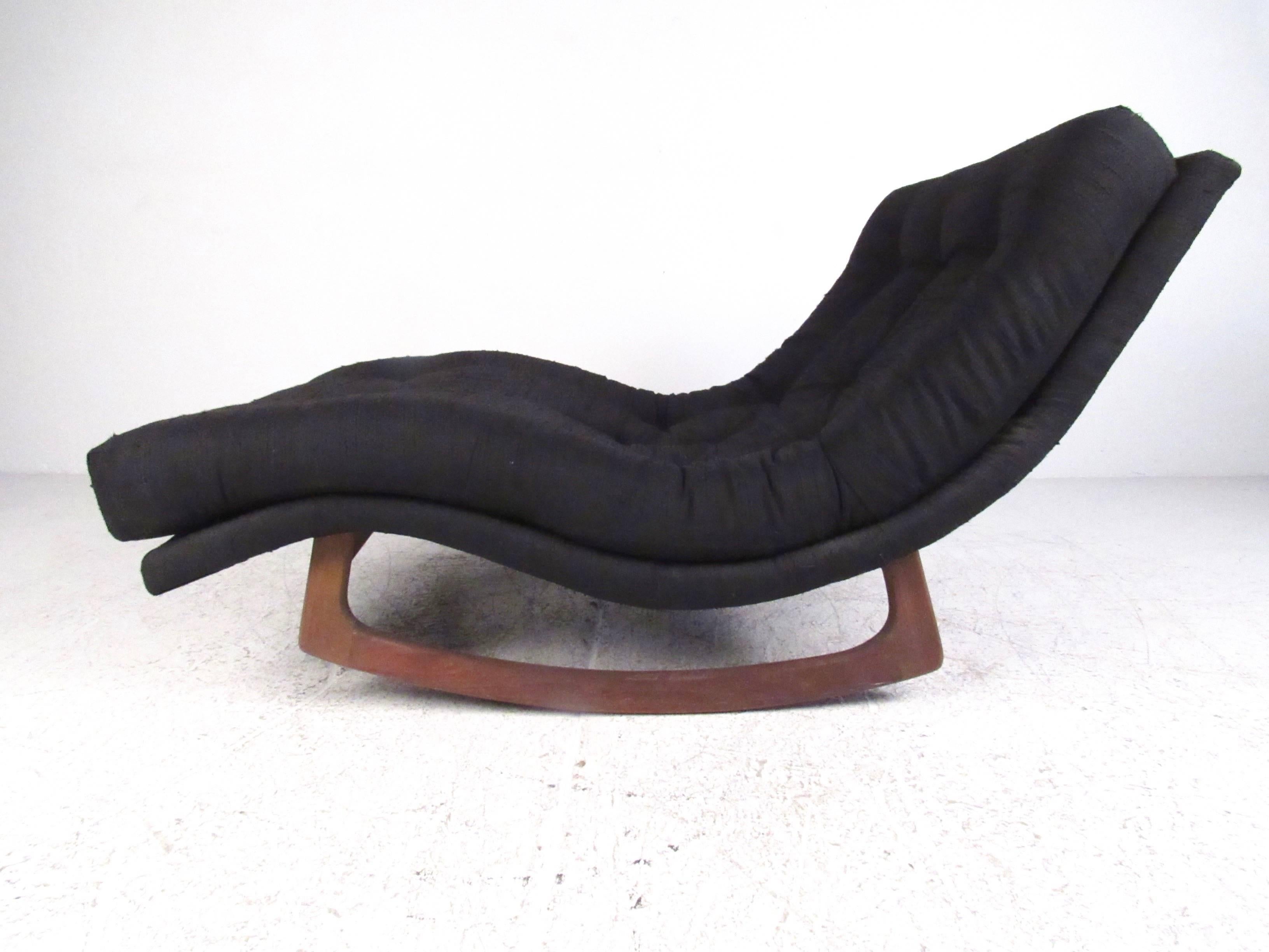 This stylish wave style lounge chair features tufted fabric and comfortable sculpted chaise design. Walnut rocking base sets this Adrian Pearsall rocking chaise longue apart from other vintage options, and makes it an impressive addition to any