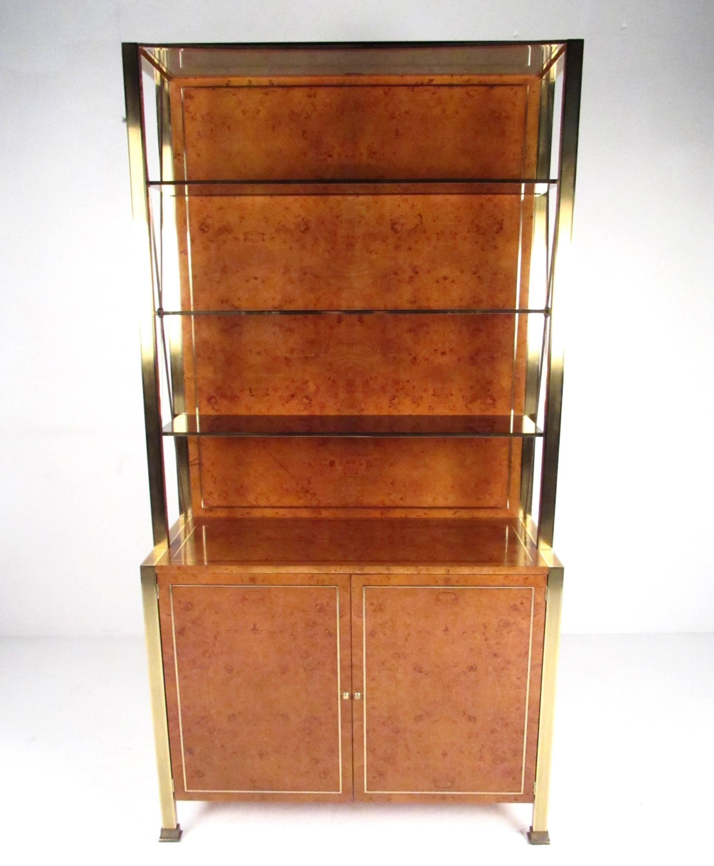 This stylish Mid-Century Modern cabinet offers a mix of shelved cabinet storage and open etagere style display with Italian design aesthetics. Smoked glass shelves, brass trim and rich burl finish add to the elegant appeal of this vintage Willy