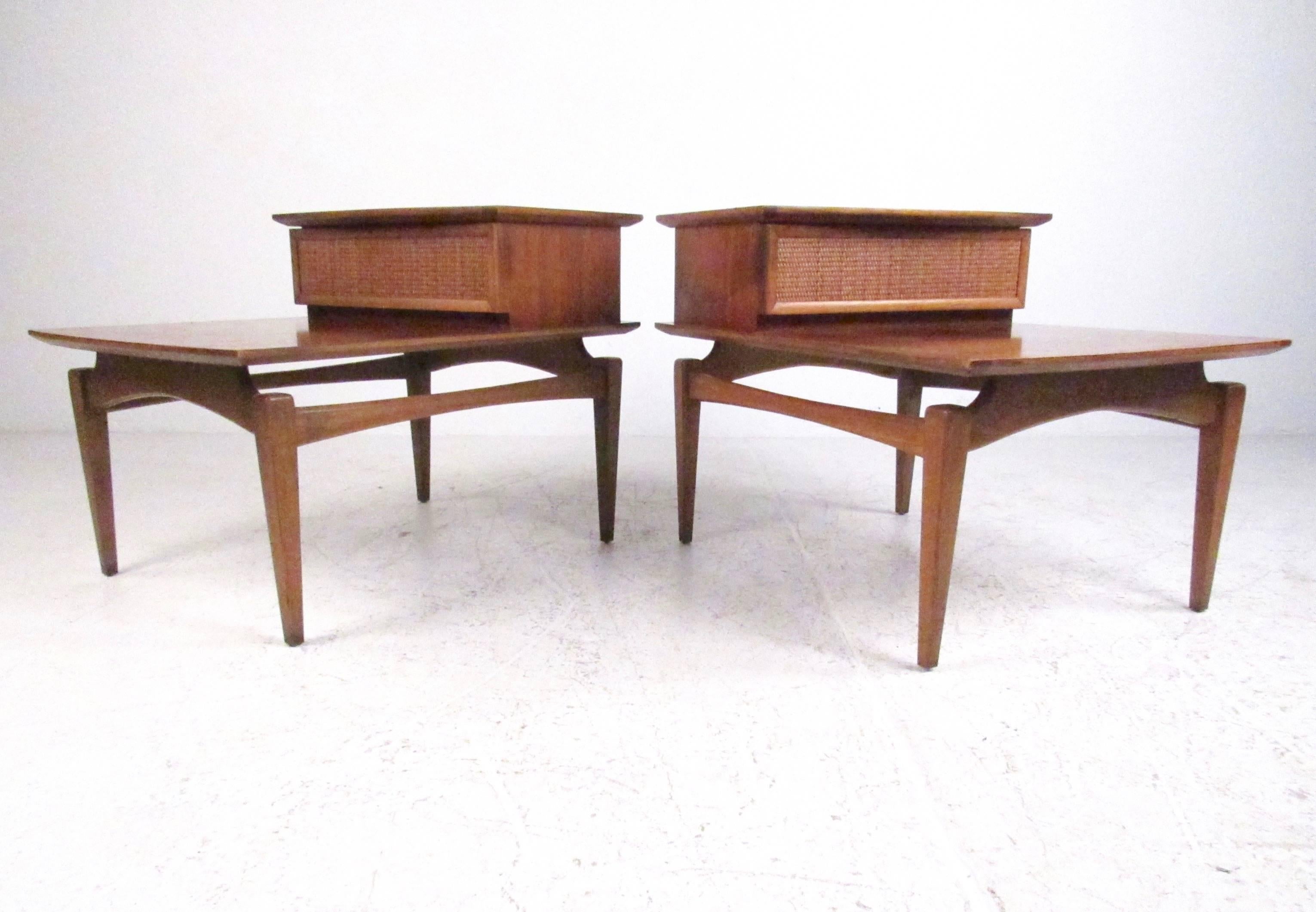 This stylish pair of Mid-Century end tables by Lane Furniture feature stylish sculpted frames, tapered legs, floating top, and unique cane front drawer. Wonderful modern lines combined with vintage wood finish make these an elegant vintage addition