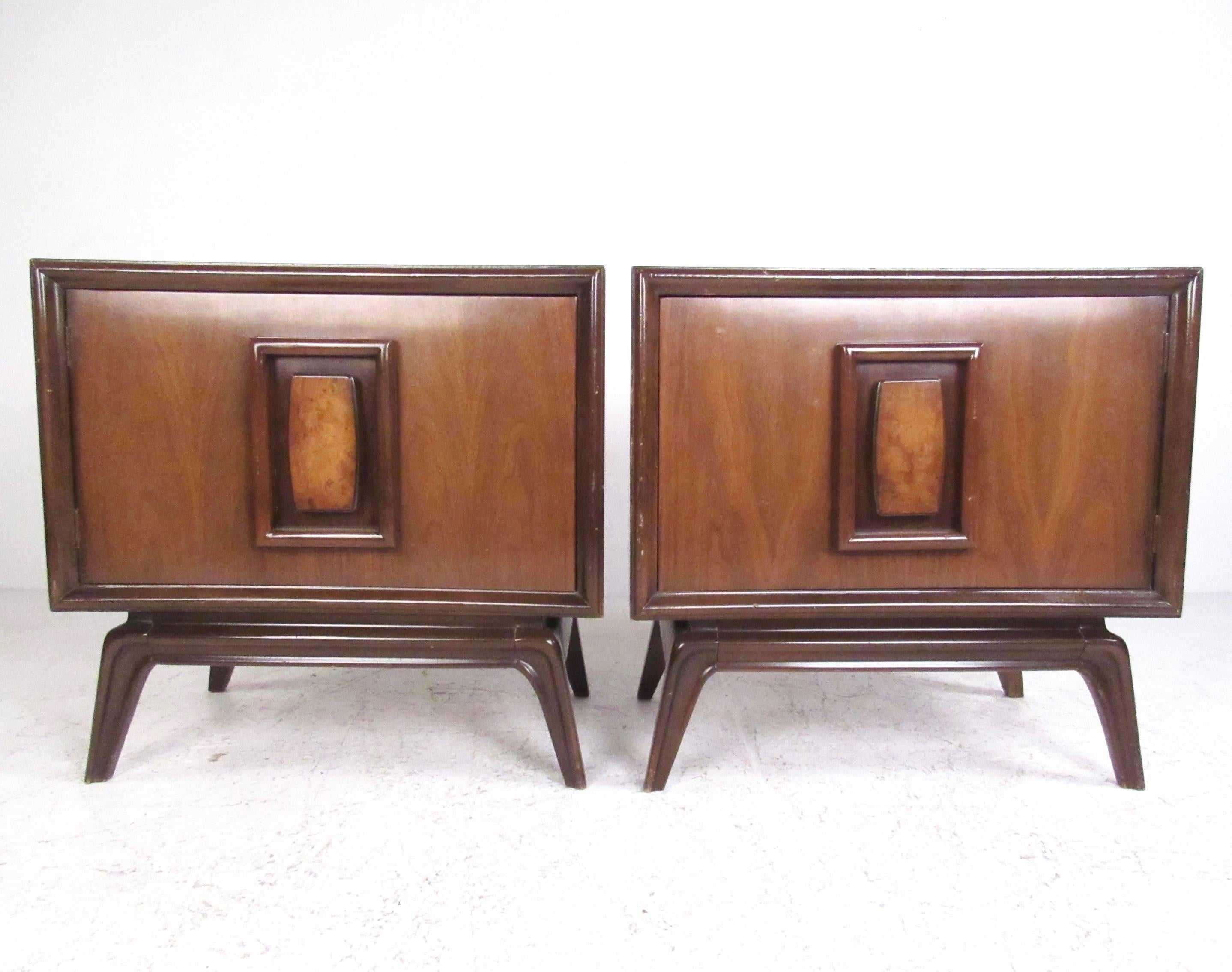 This pair of sculpted front American walnut end tables feature rich walnut finish with unique decorative detail. Tapered legs, spacious shelved storage, and Mid-Century Modern style make this matching pair an impressive addition to bedroom or living