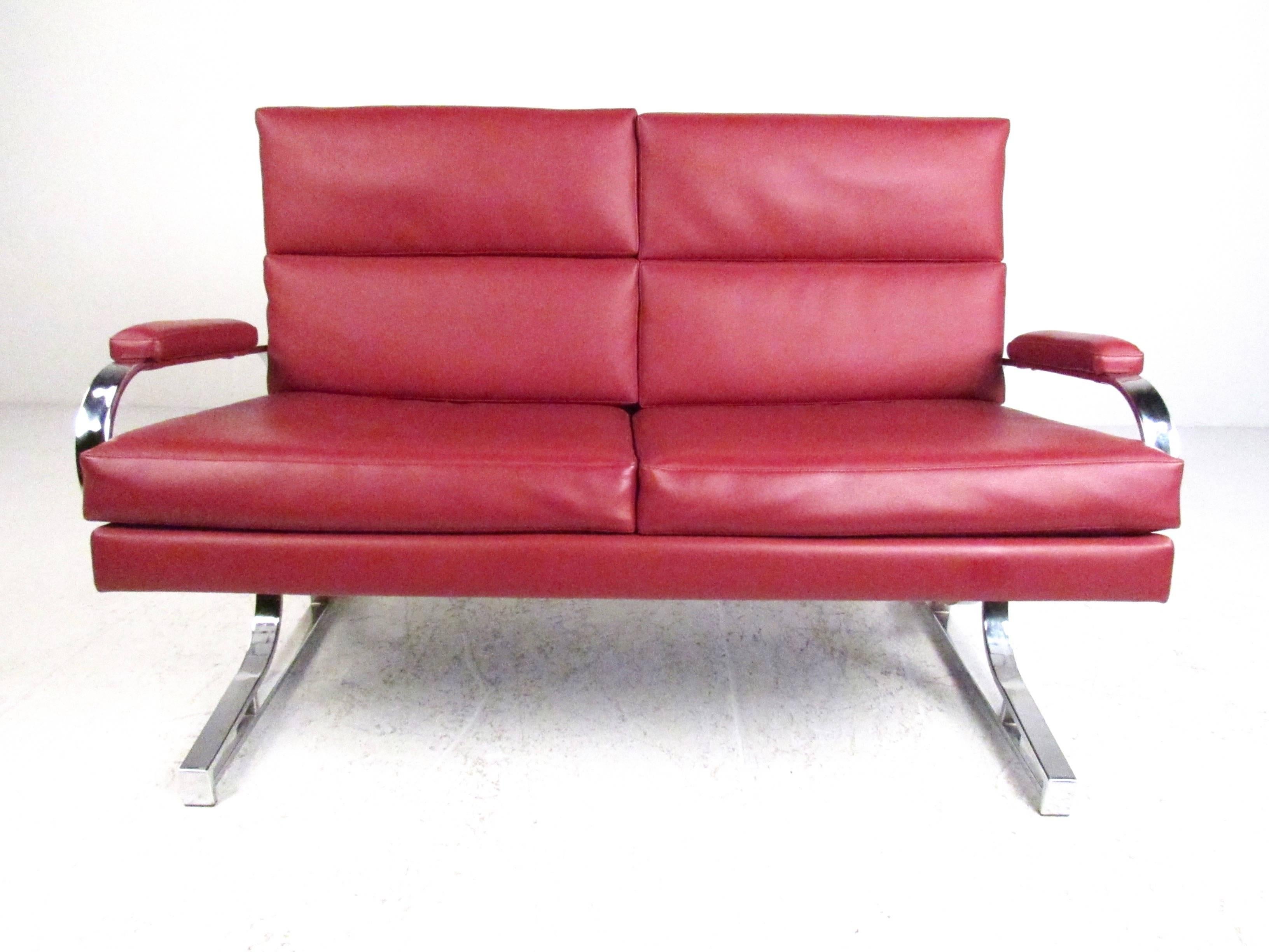 This unique loveseat features heavy chrome frame, plush vinyl upholstery, and a stylish modern design. The perfect mix of style and comfort, this two-seat sofa is perfect for home or business seating. Please confirm item location (NY or NJ).